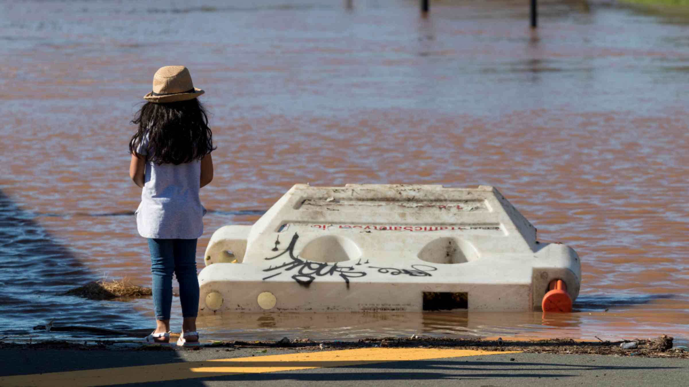 A child views flood damage after Hurricane Ida in New Brunswick, New Jersey