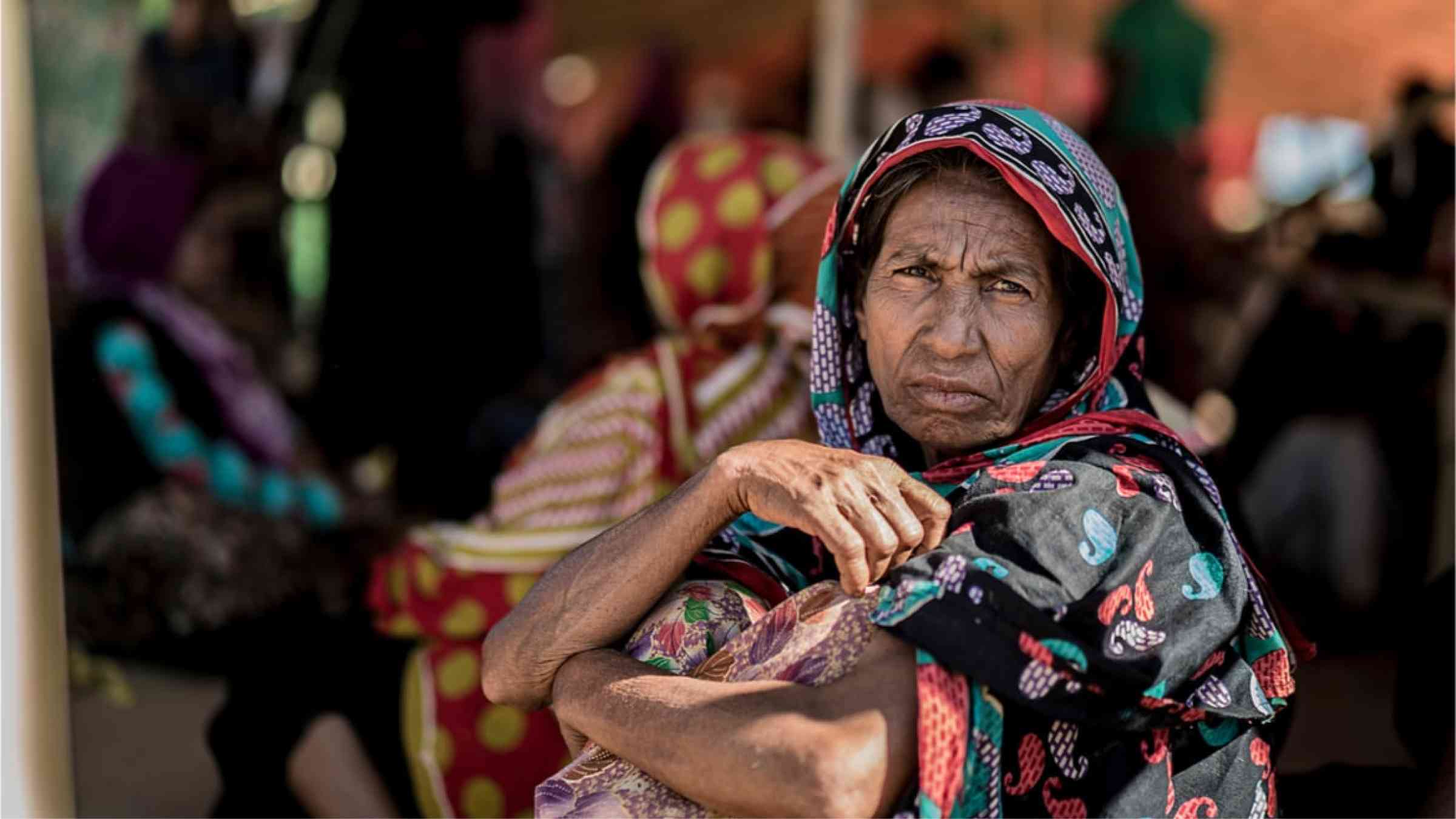 An older woman from Bangladesh in Cox Bazar looking into the camera.
