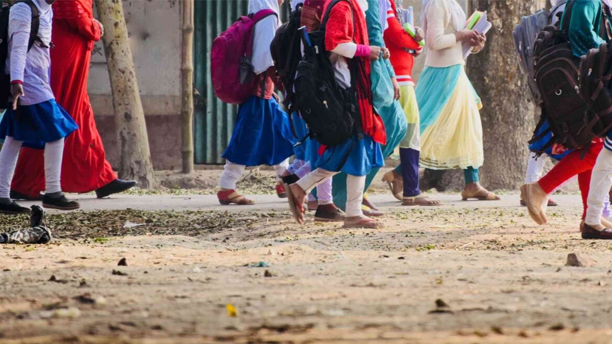 School girls walking in a road in Bangladesh