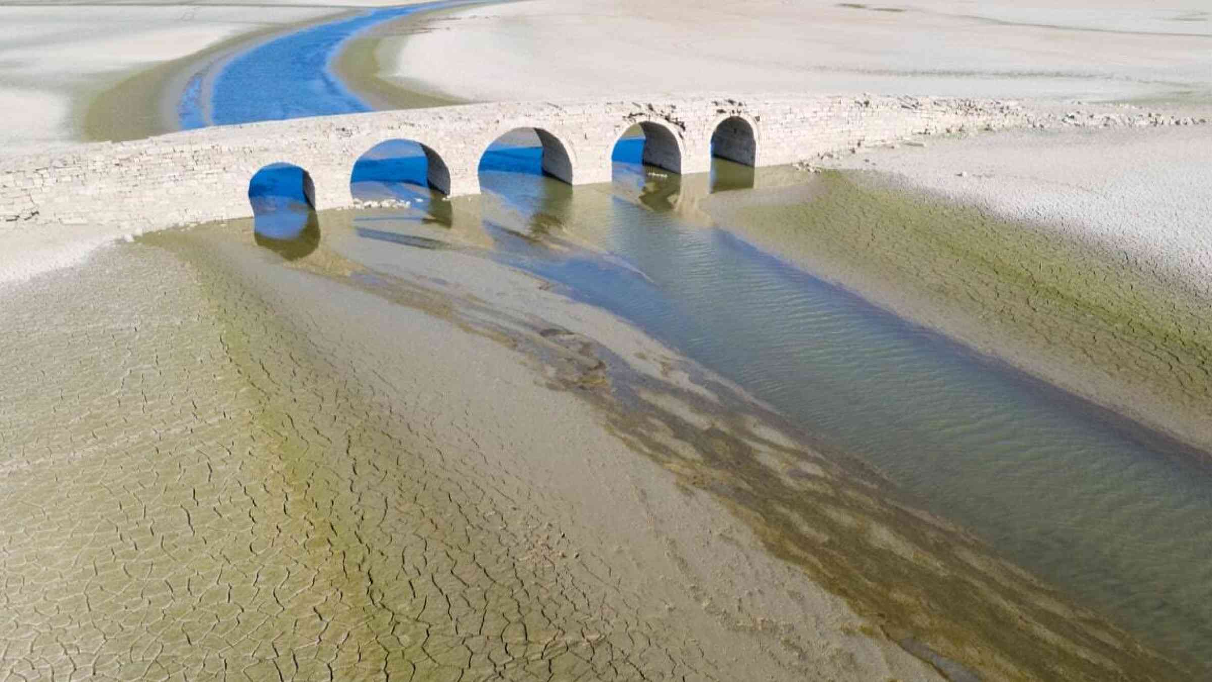 A Ming dynasty bridge is exposed by very low water levels in a river in Jiangxi province, China