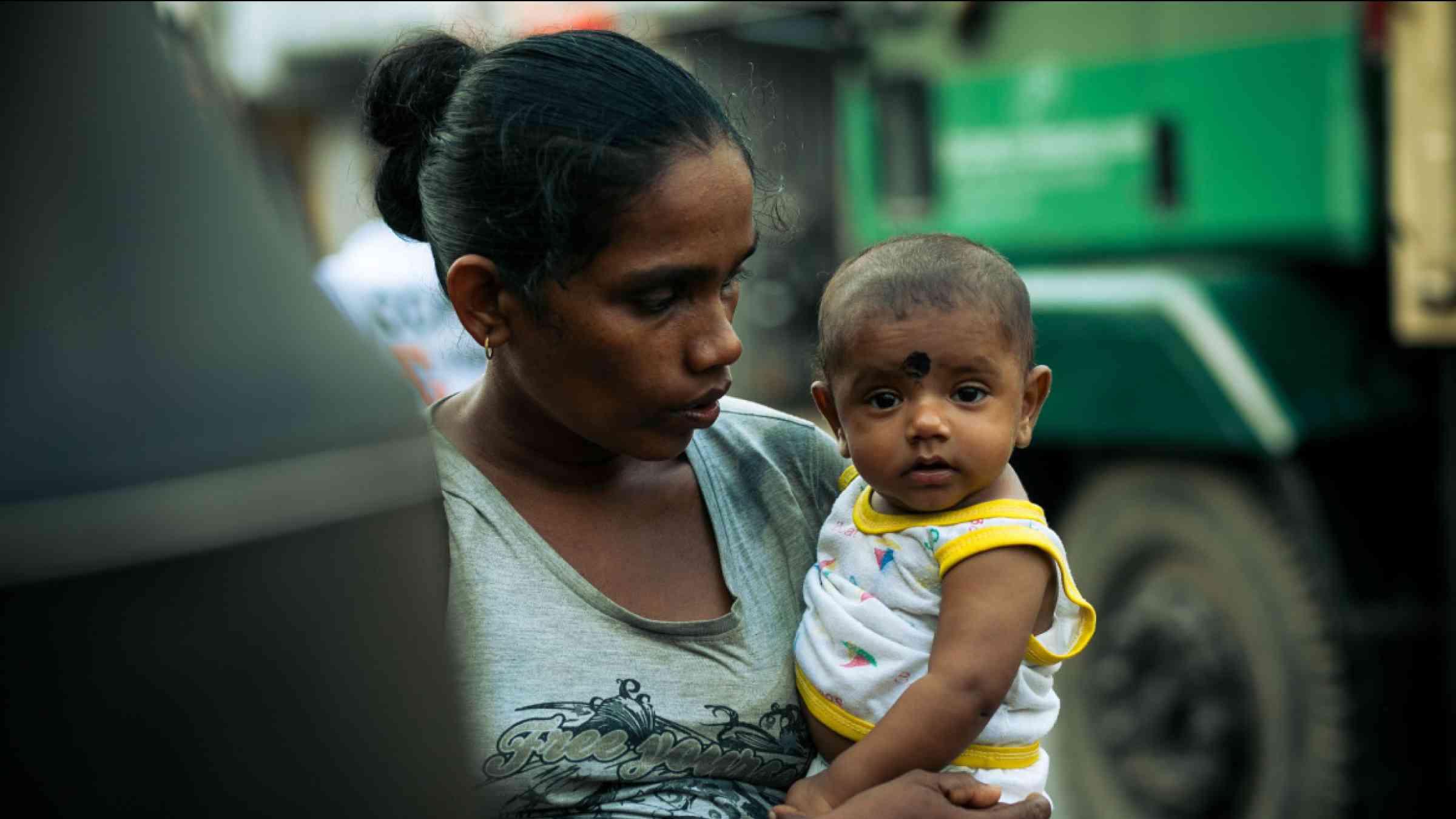 Indian woman with her child on the street New Delhi