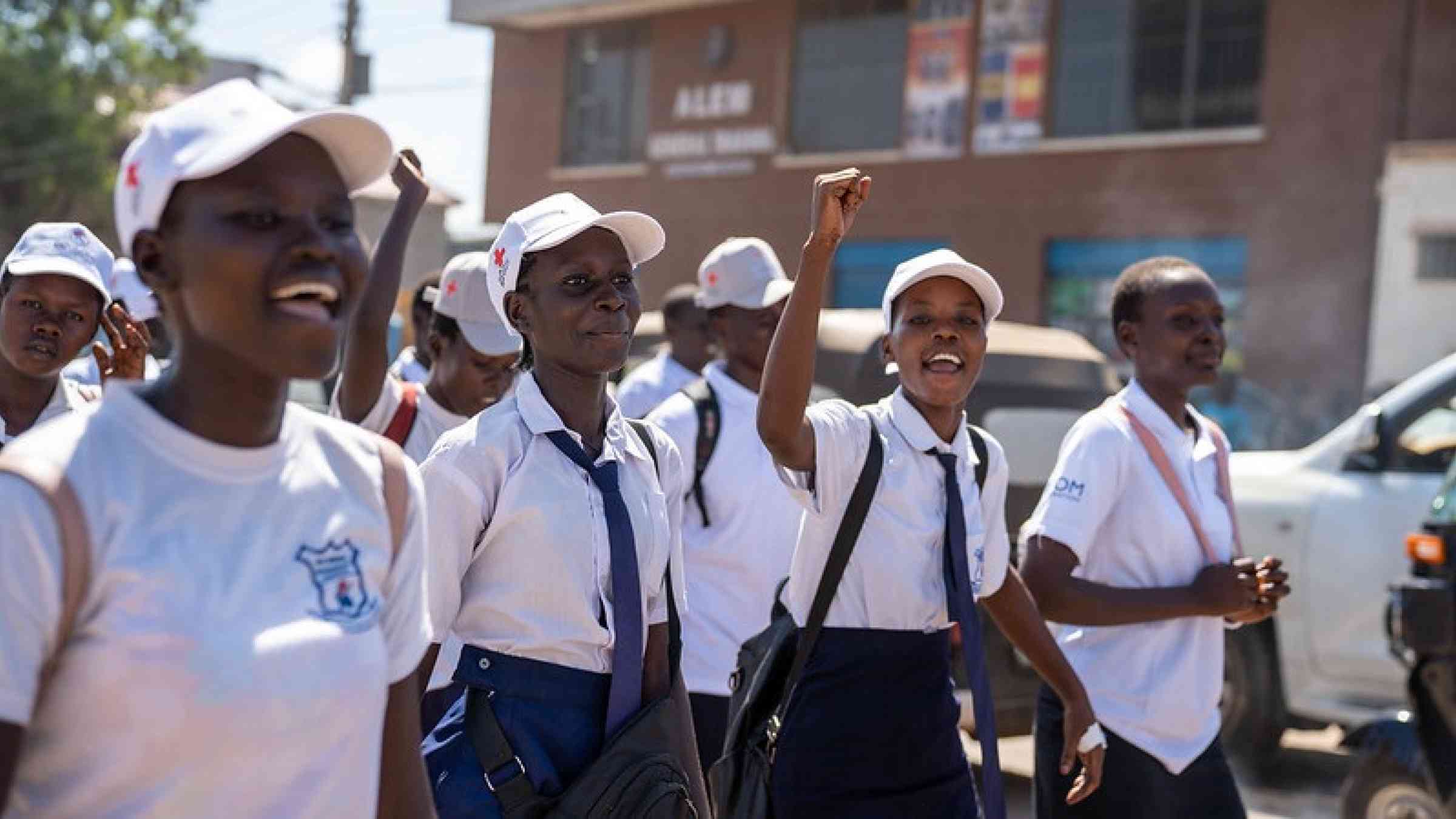 Young women take part in a march to raise awareness of disaster risk in Juba, South Sudan.