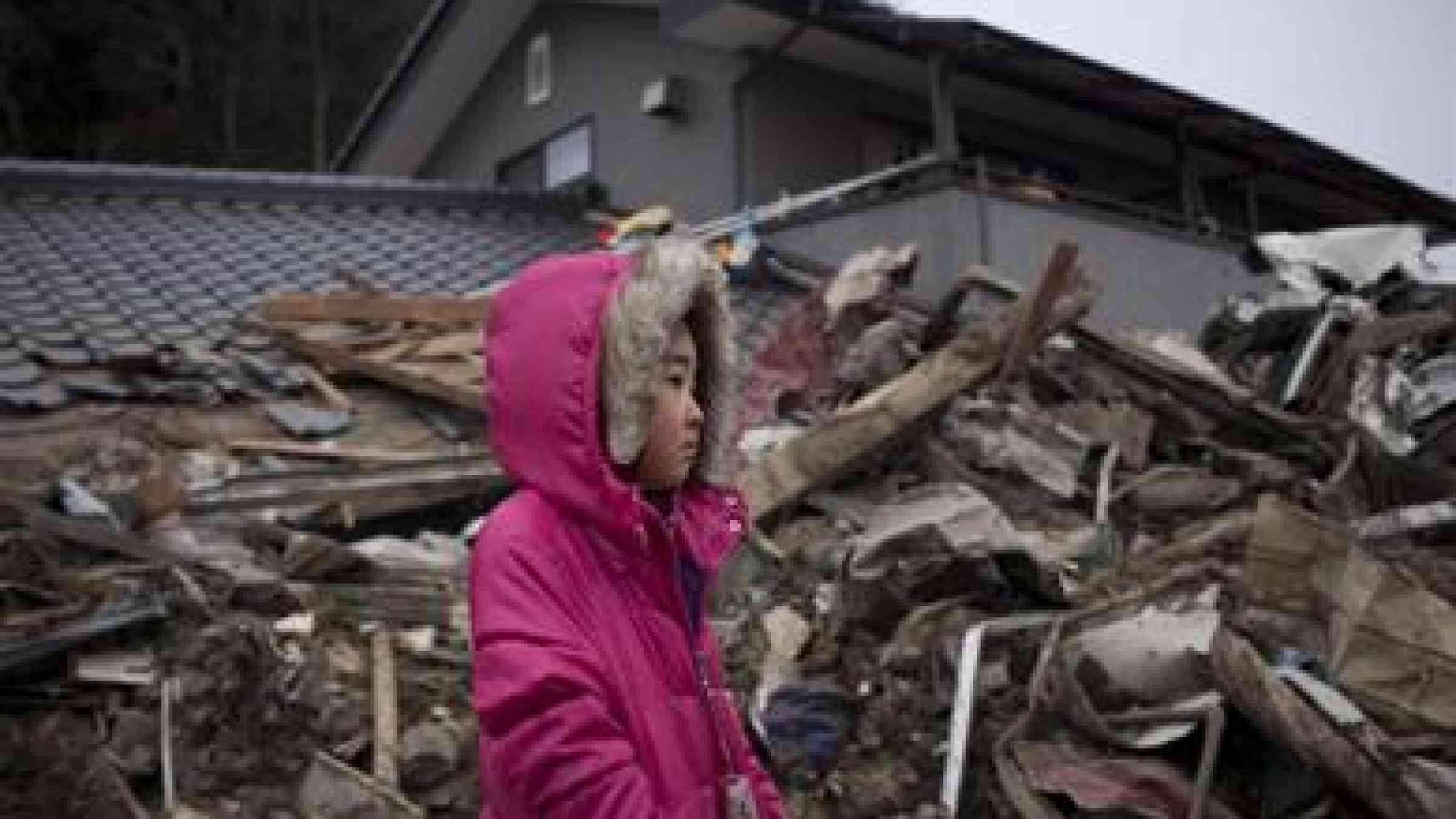Photo by UNICEF/NYHQ2011-0427/Dean Neena (5) surveys the wreckage of her home, which was destroyed by the 2011 tsunami in Japan https://unicefconnect.files.wordpress.com/2015/03/uni106631.jpg?w=667