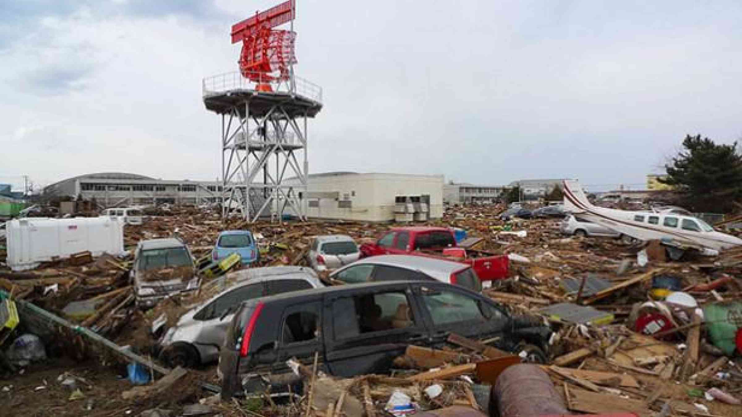 Photo by Flickr user Roberto De Vido CC BY 2.0 https://www.flickr.com/photos/bigocean/5531542919/  Debris scattered around airport in Sendai, Japan, after the devastating earthquake and tsunami in March 2011.