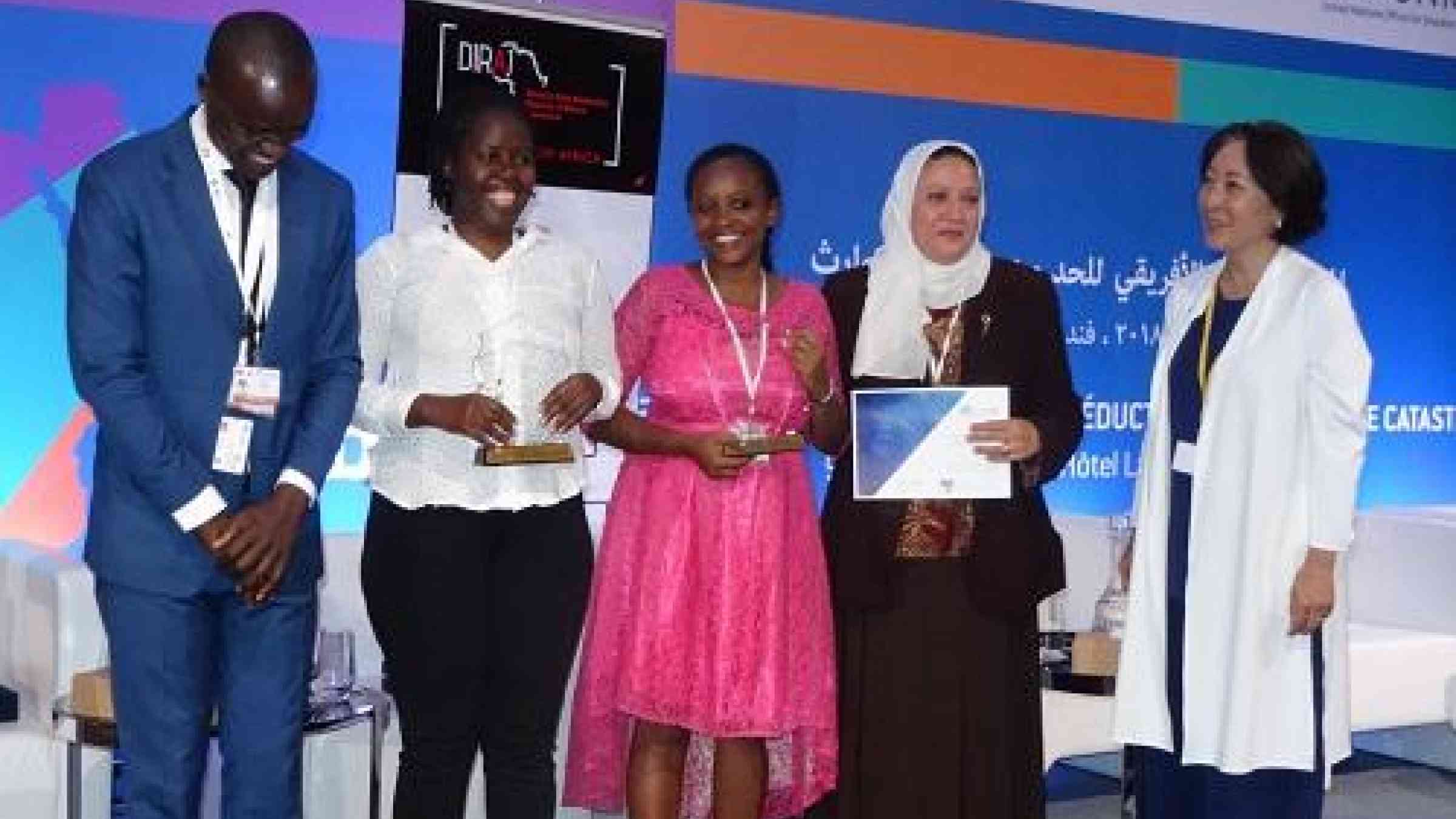 From left: Diraj founder, David Owino with media award winners, Ruth Keah Kadide, Kenya, Dicta Asiimwe, Uganda, Mai Elshafei, Egypt, and UNISDR head, Mami Mizutori