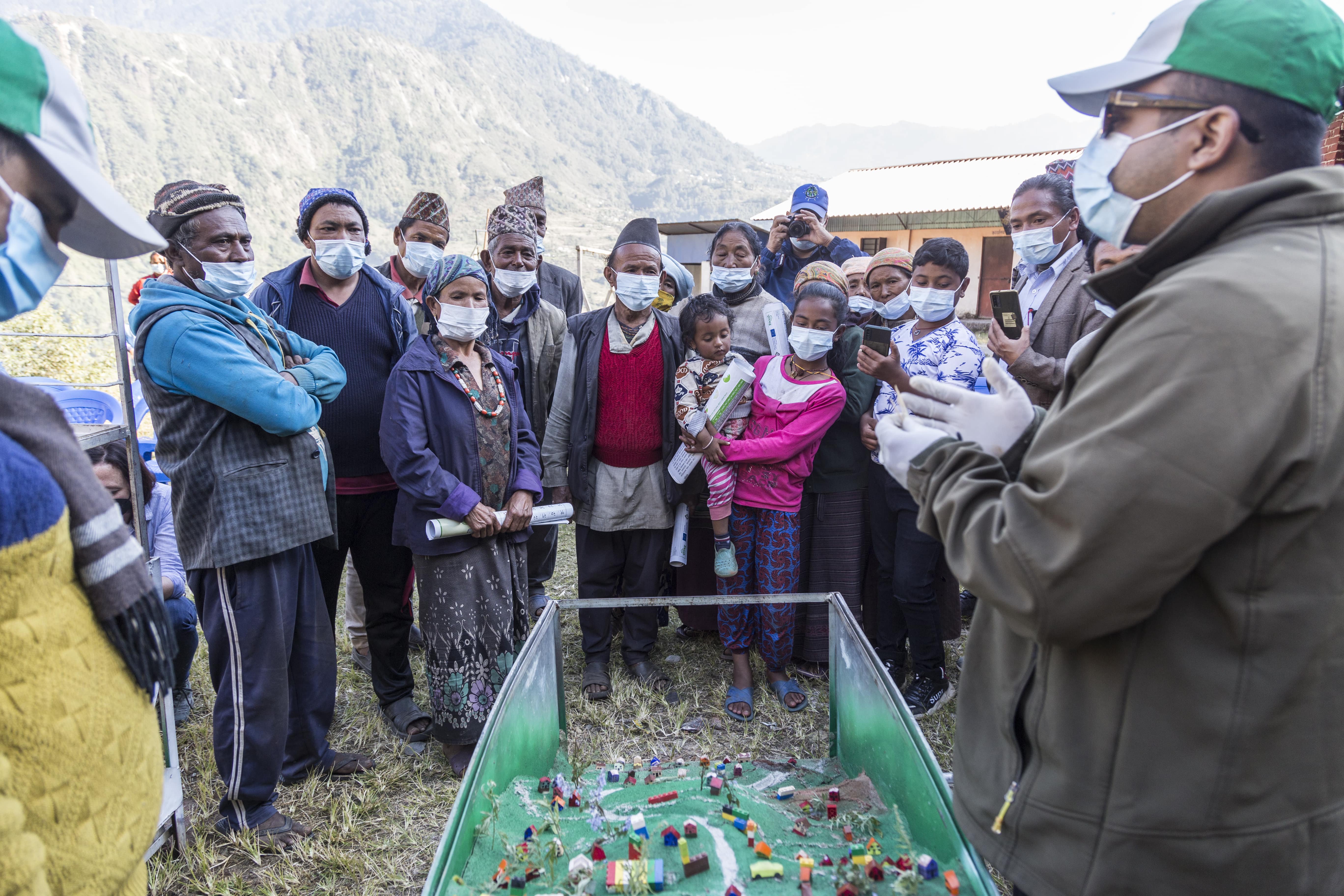 Miniature community, road and landscape are developed using local materials and demonstrated in communities about how the earthquake, rainfall and human induced development work causes landslides and what can be done to mitigate the risks.