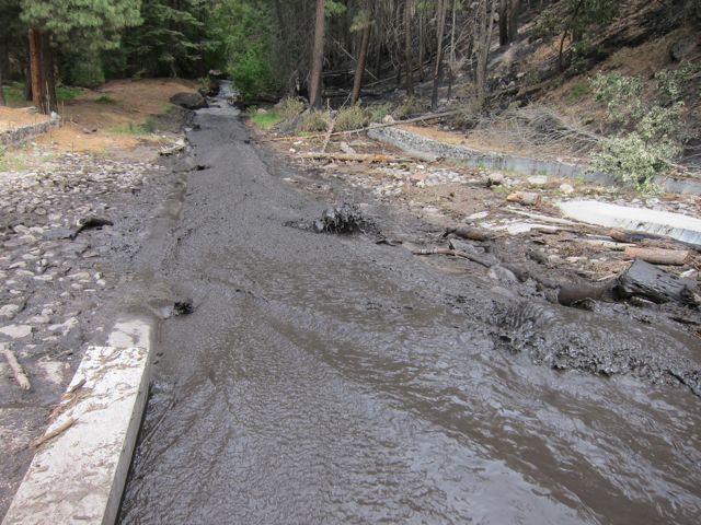 Ash and sedimentation saturating a stream in Las Conchas, New Mexico (Photo credit: USDA Forest Service. Public Domain).