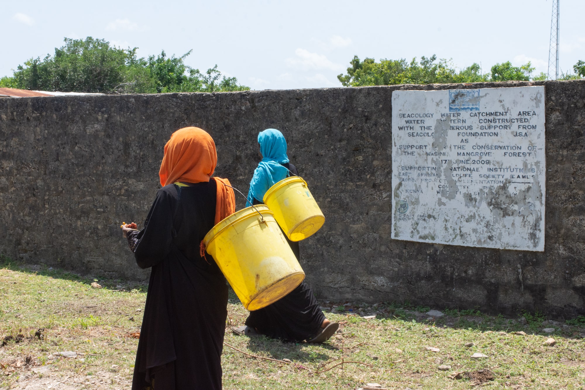 Women on their way to collect water from the cisterns.