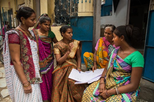 Women discussing the designs and plans for a project