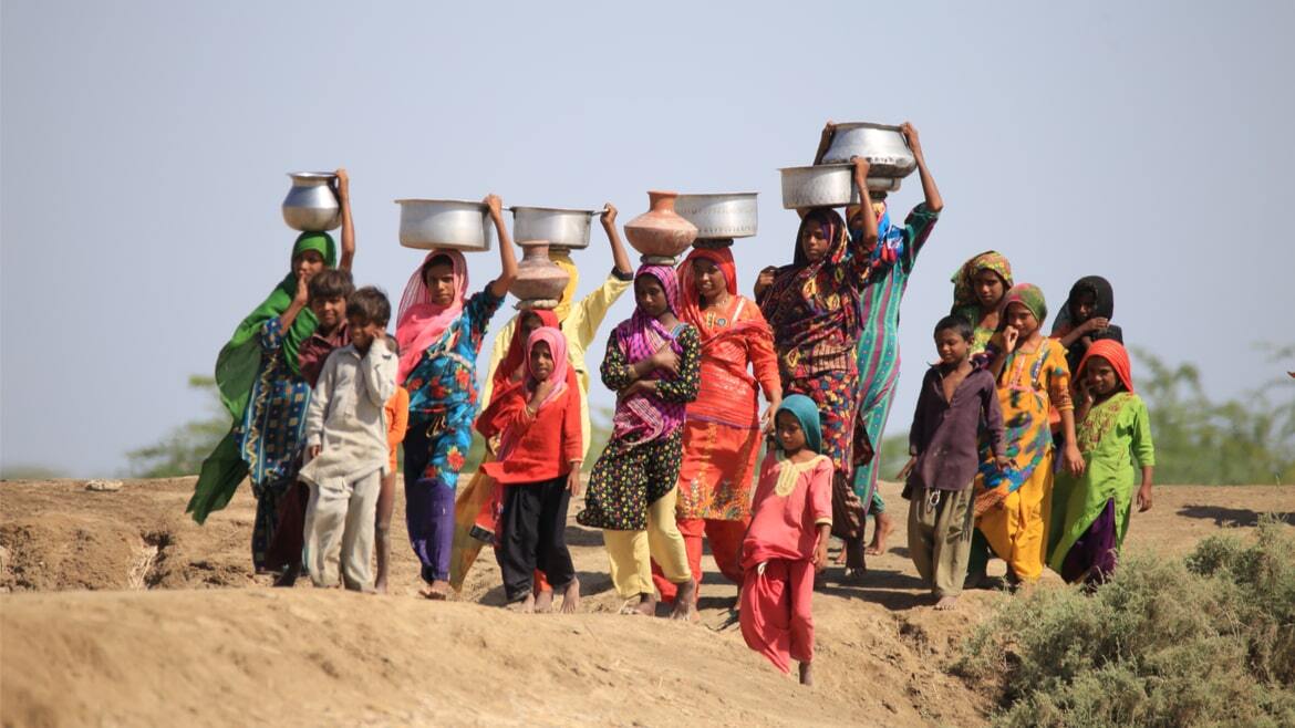 Women fetching drinking water. Sindh, Pakistan, 2019