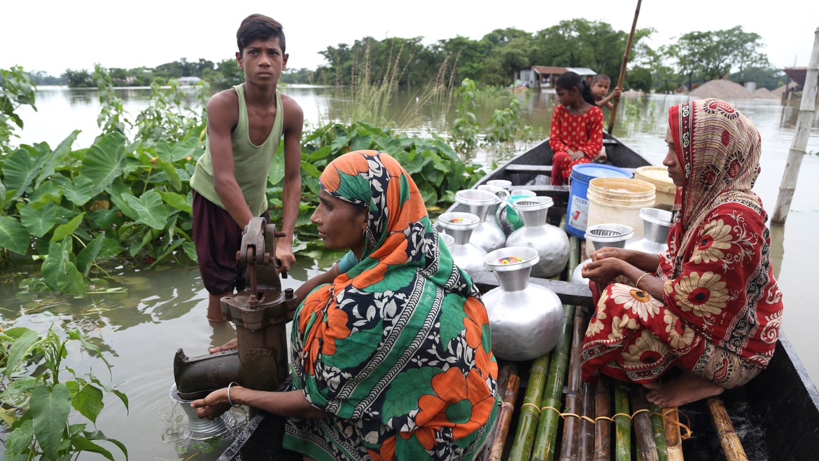 People in flood-prone areas are collecting pure water from tube wells (Bangladesh)