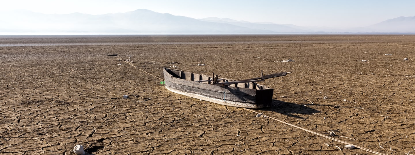 Dry lake bed with boat