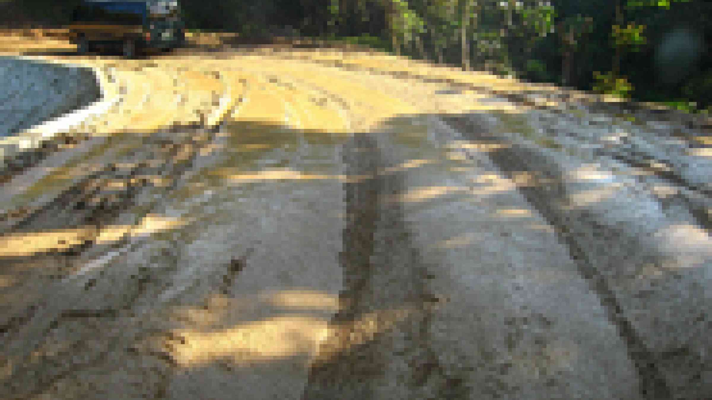 Philippines mud road; photo by flickr user erasmusa, creative commones attribution attribution-noncommercial-share alike 2.0 generic