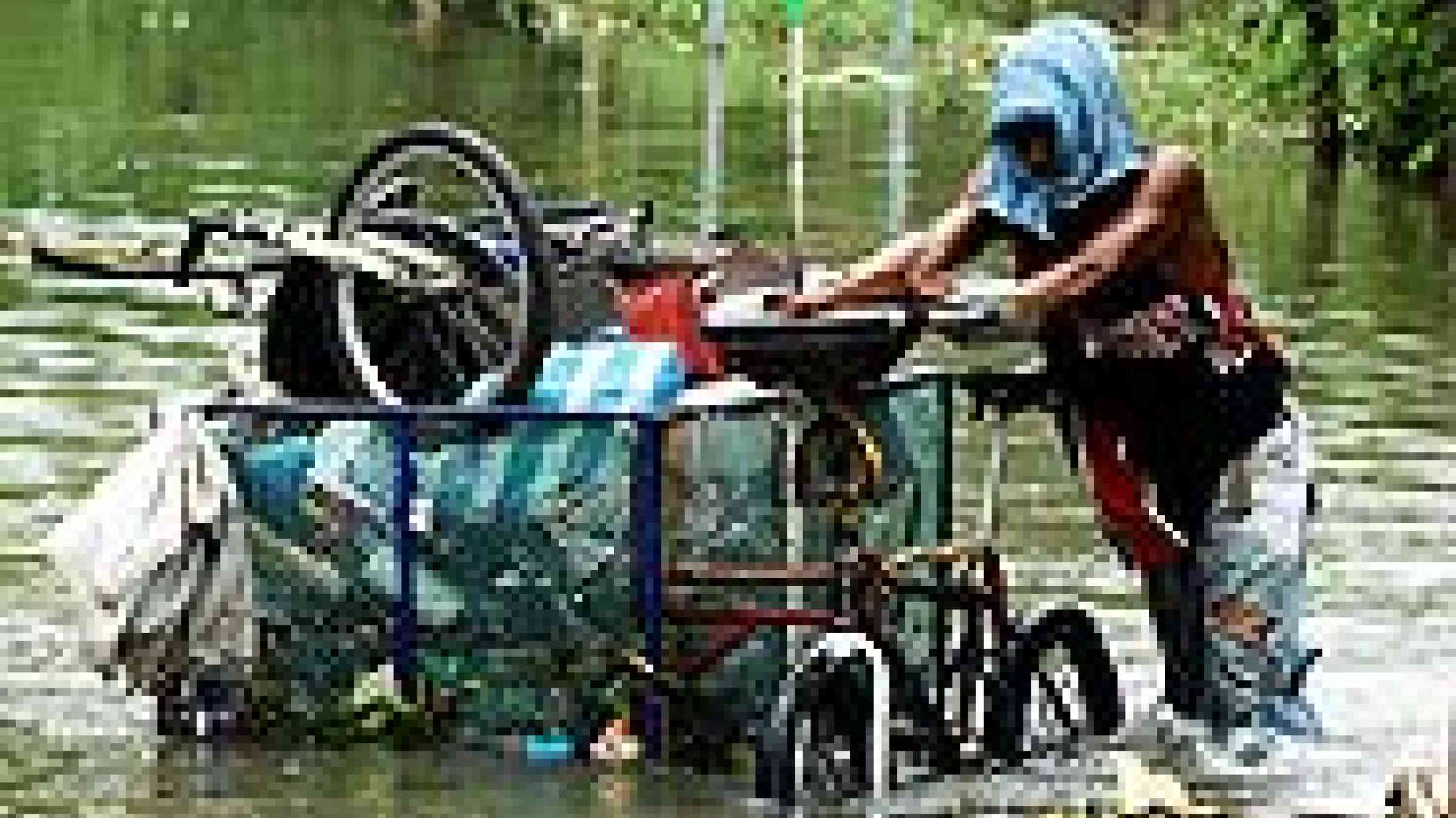 Photo by Flikr user IRRI, Residents of Los Baños and Bay towns, along the coast of Laguna de Bay and about 60 kilometers south of Manila, cope with floodwaters that have not receded 3 days after Typhoon Ondoy ravaged the Philippines. Creative Comm