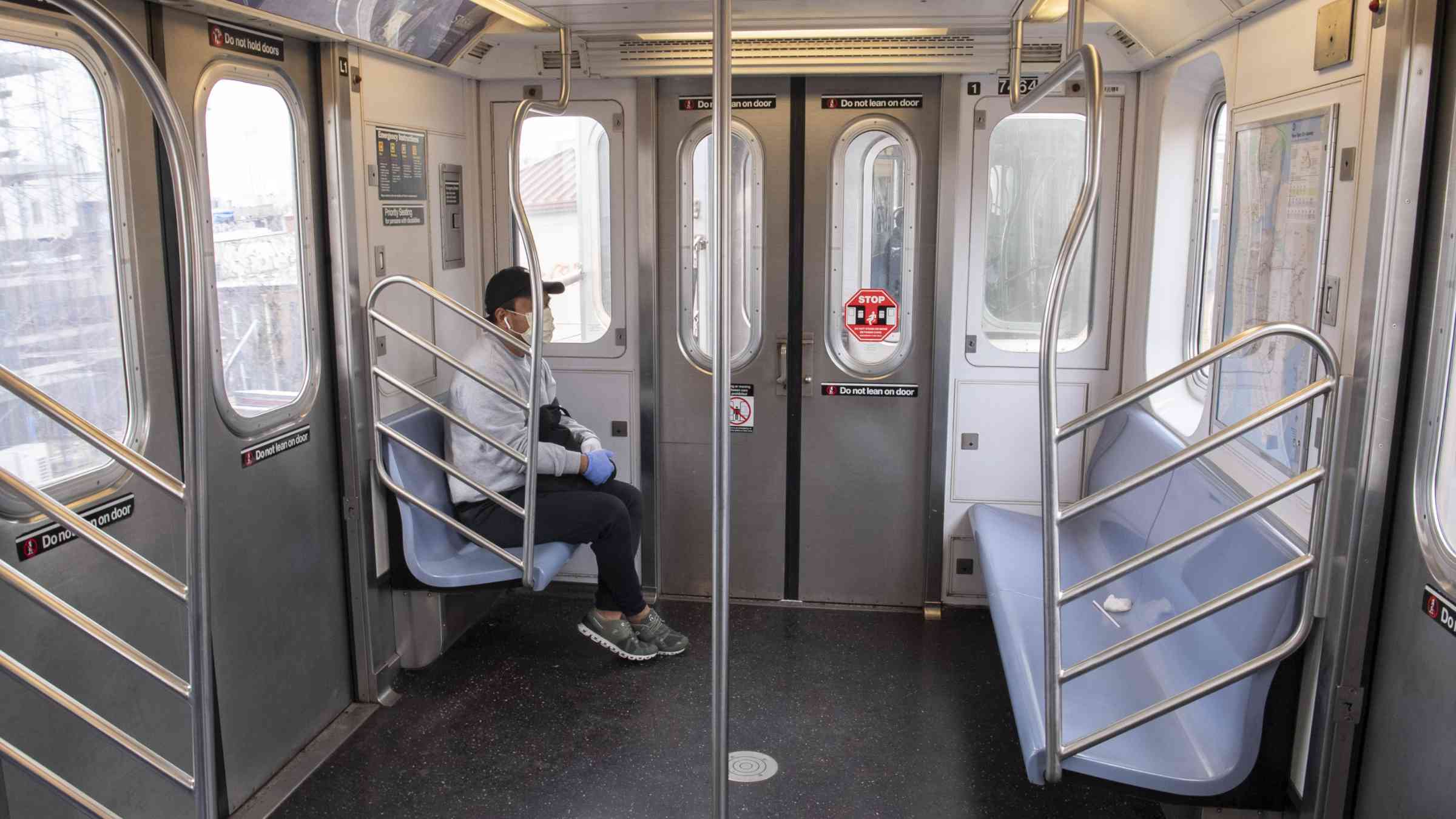A man riding a NYC subway