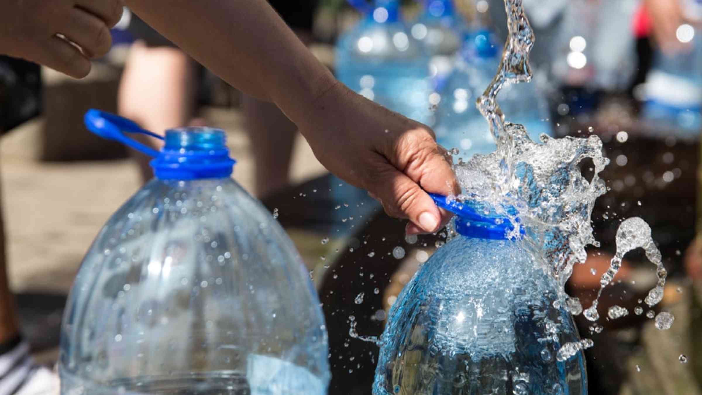 Collecting water during drought in Cape Town