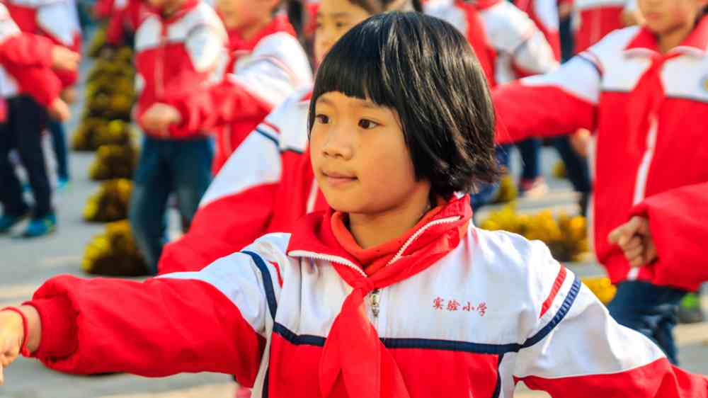 Children doing outdoor activities in a school in China