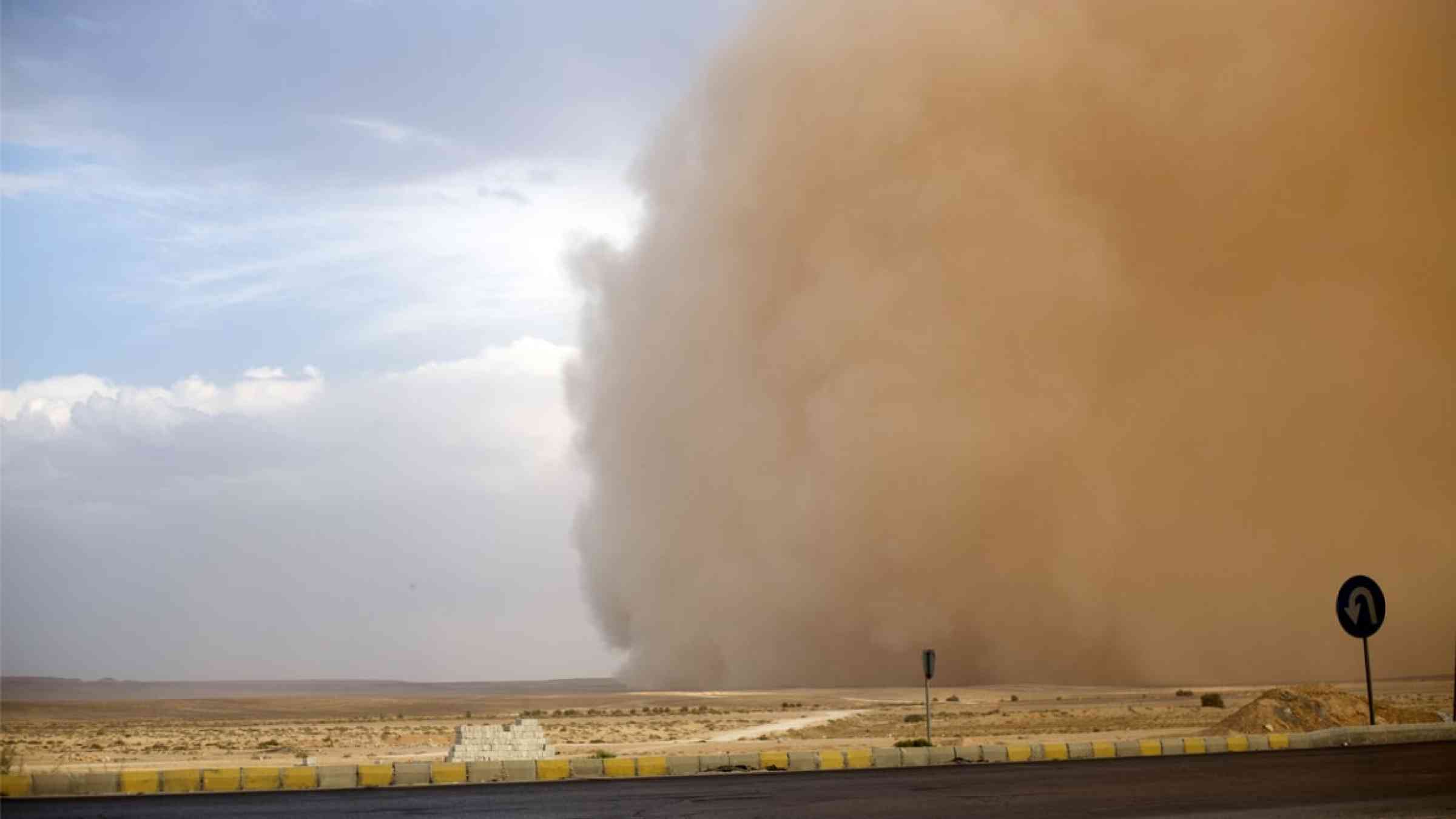 Sand storm approaching a road in Jordan
