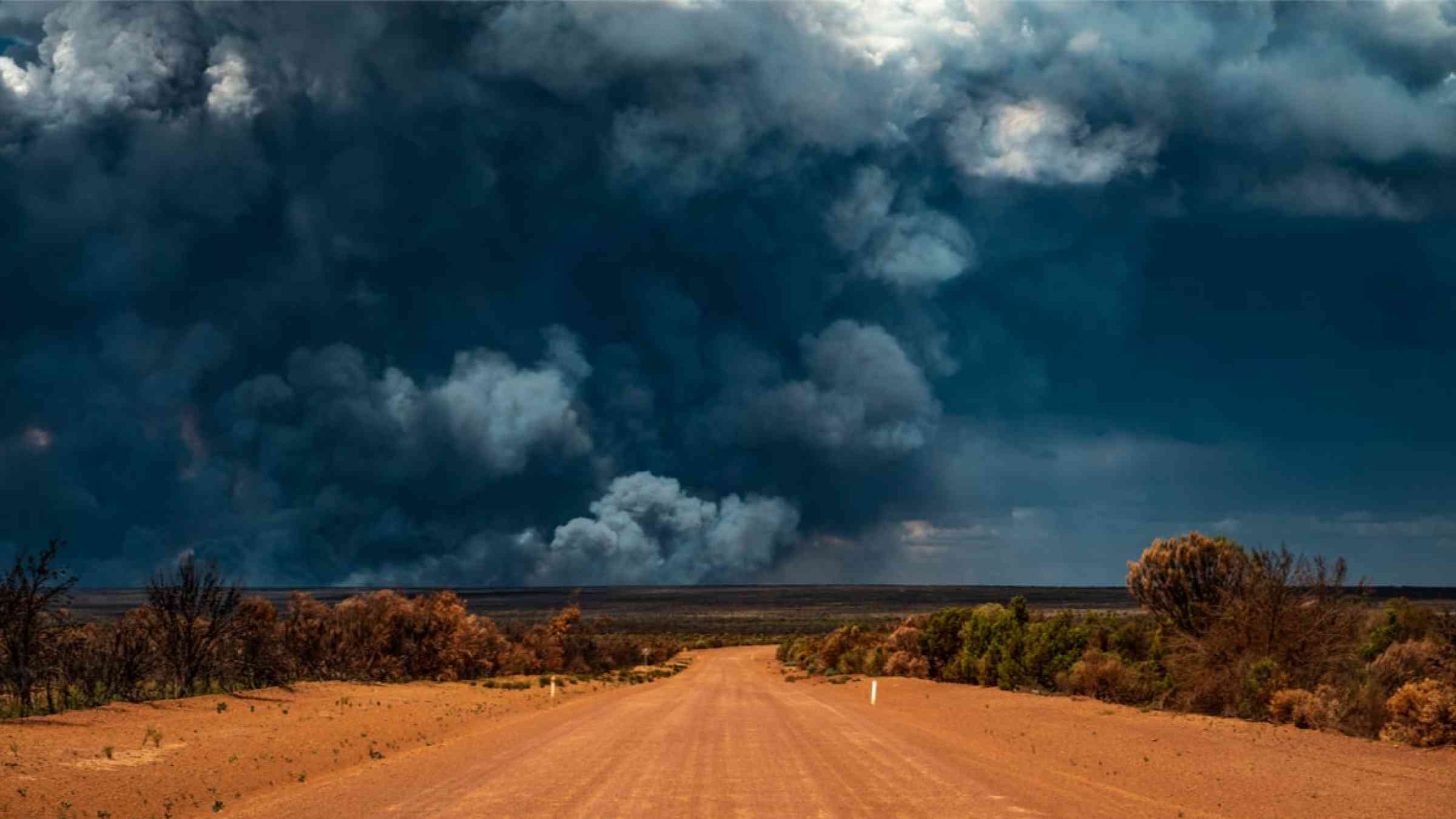 Smoke from bushfires at a distance in a rural scenery