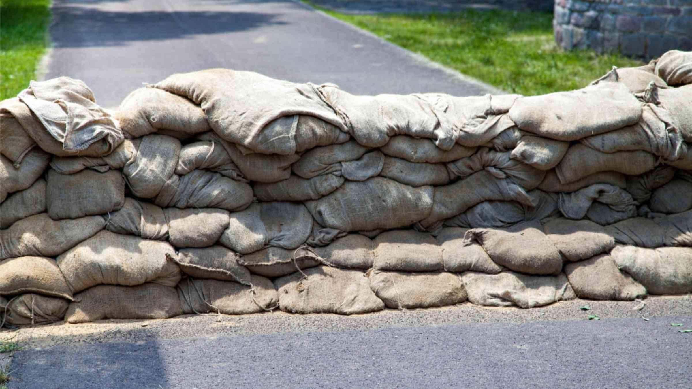 Sandbags positioned on a road to protect against floods