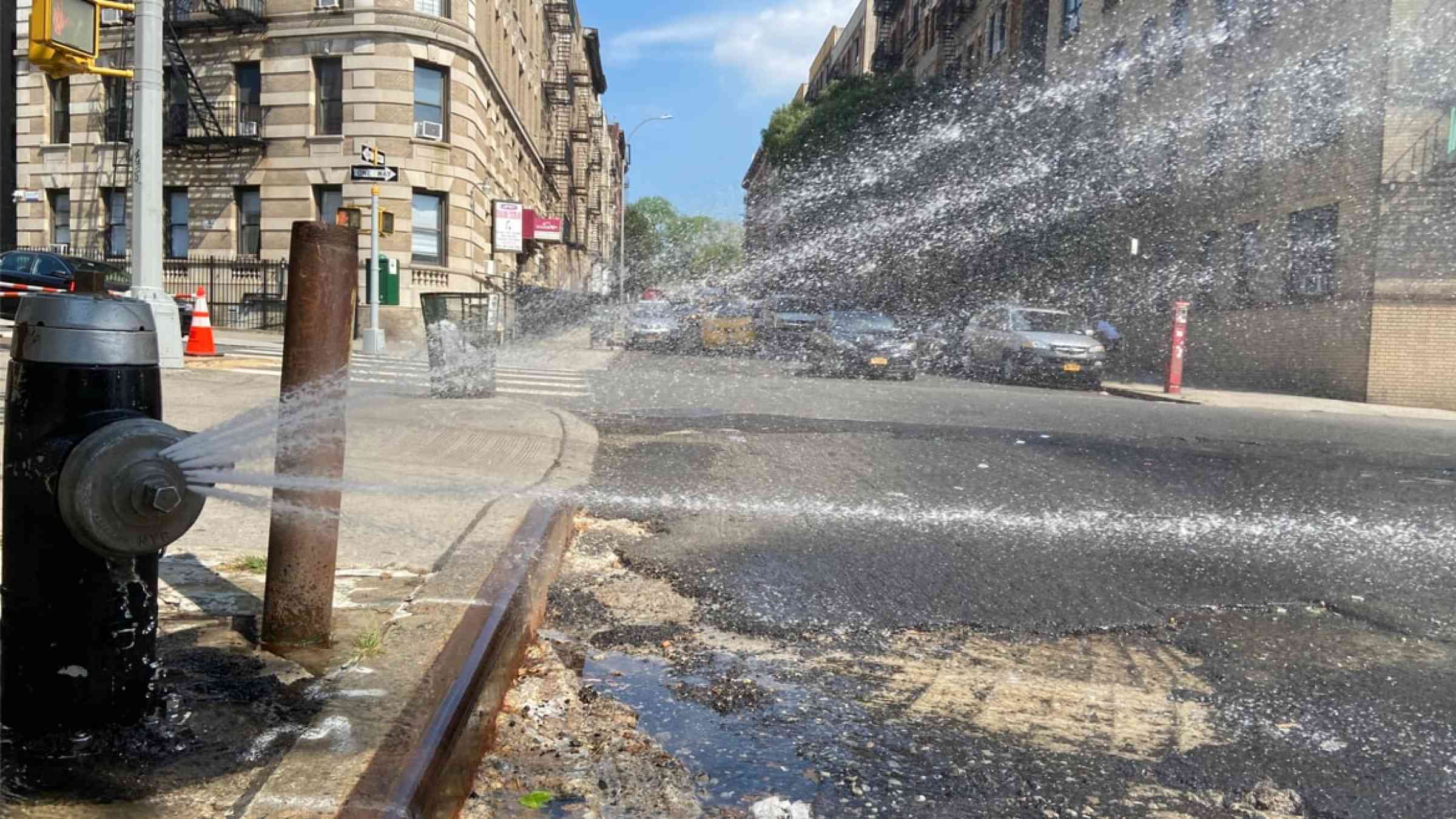 Fire hydrant sprays water in a New York City street