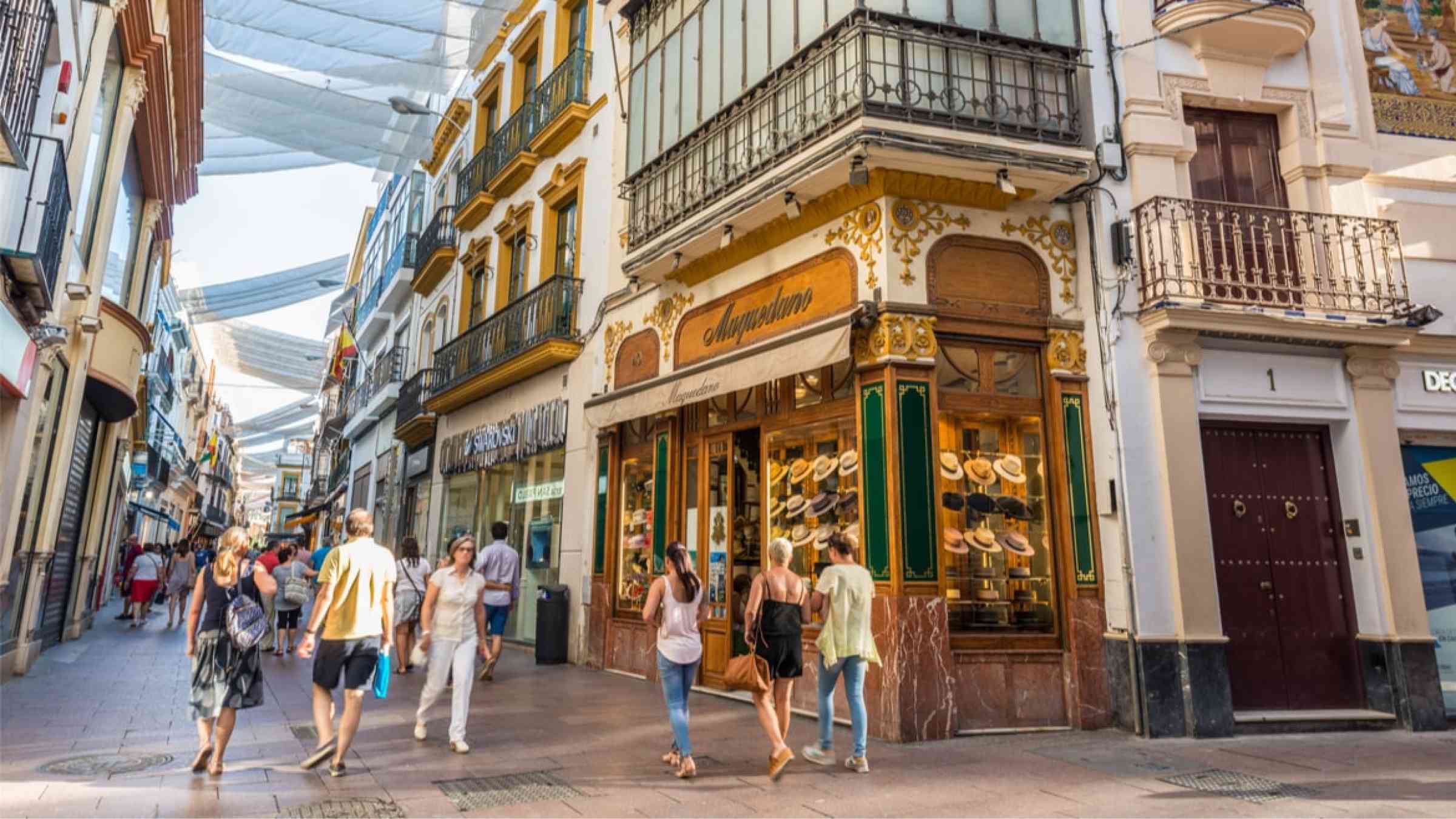 Traditional and busy shopping street in Seville, Spain (2017)