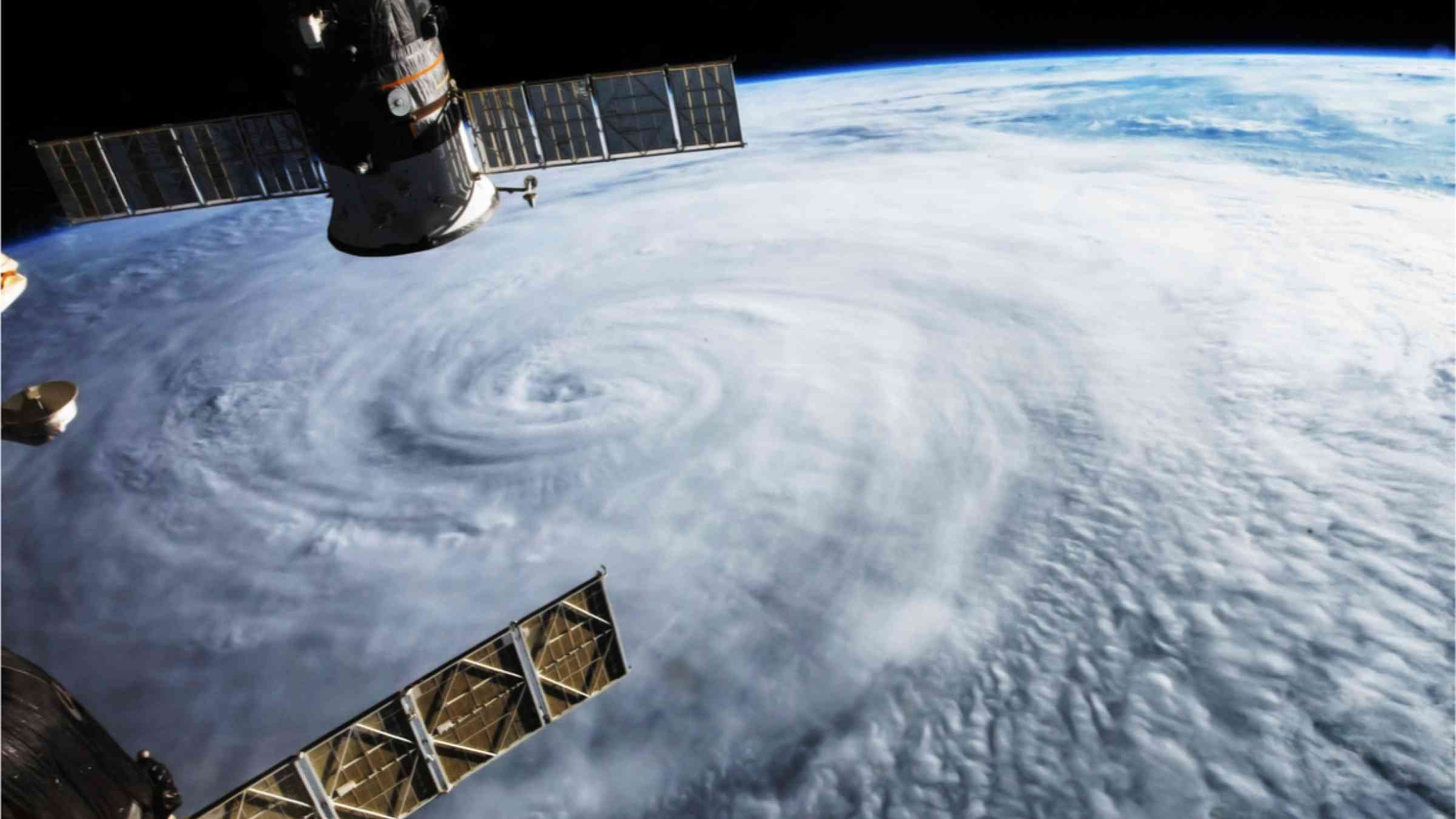 A satellite observes a hurricane from space