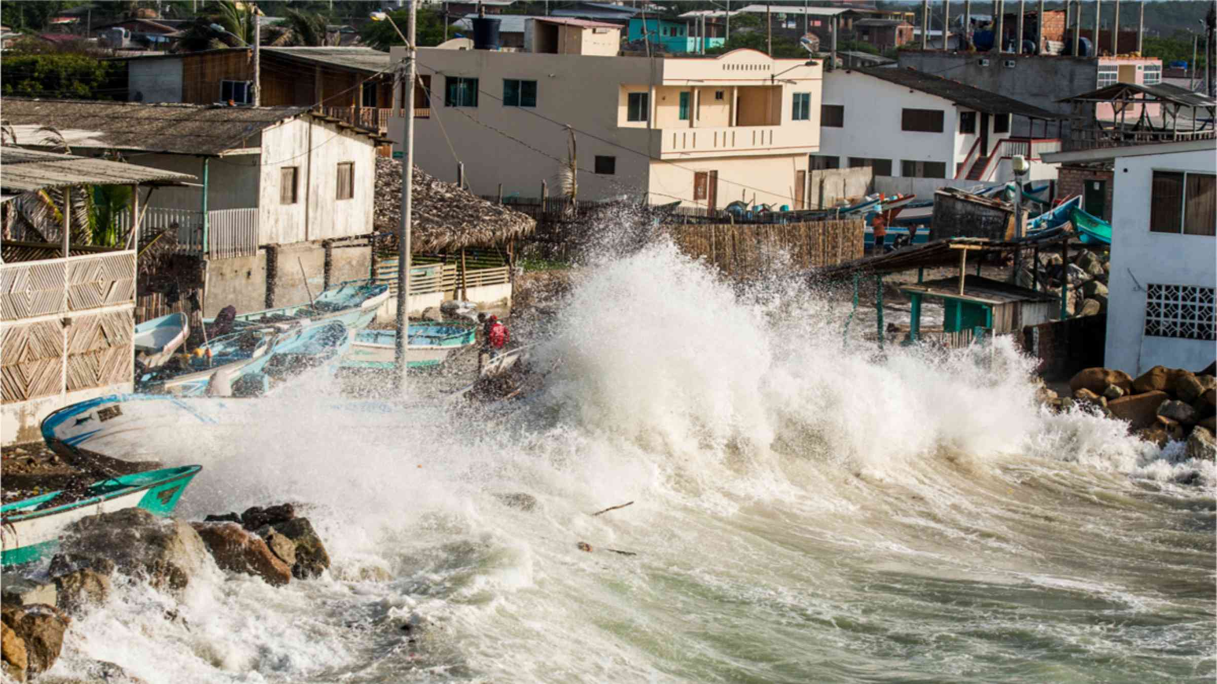 High tides, combined with rising sea levels create crashing wave on the coast of Ecuador