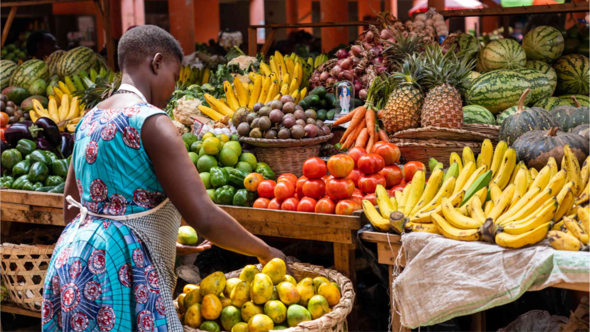 Woman at a fruit market in Africa.