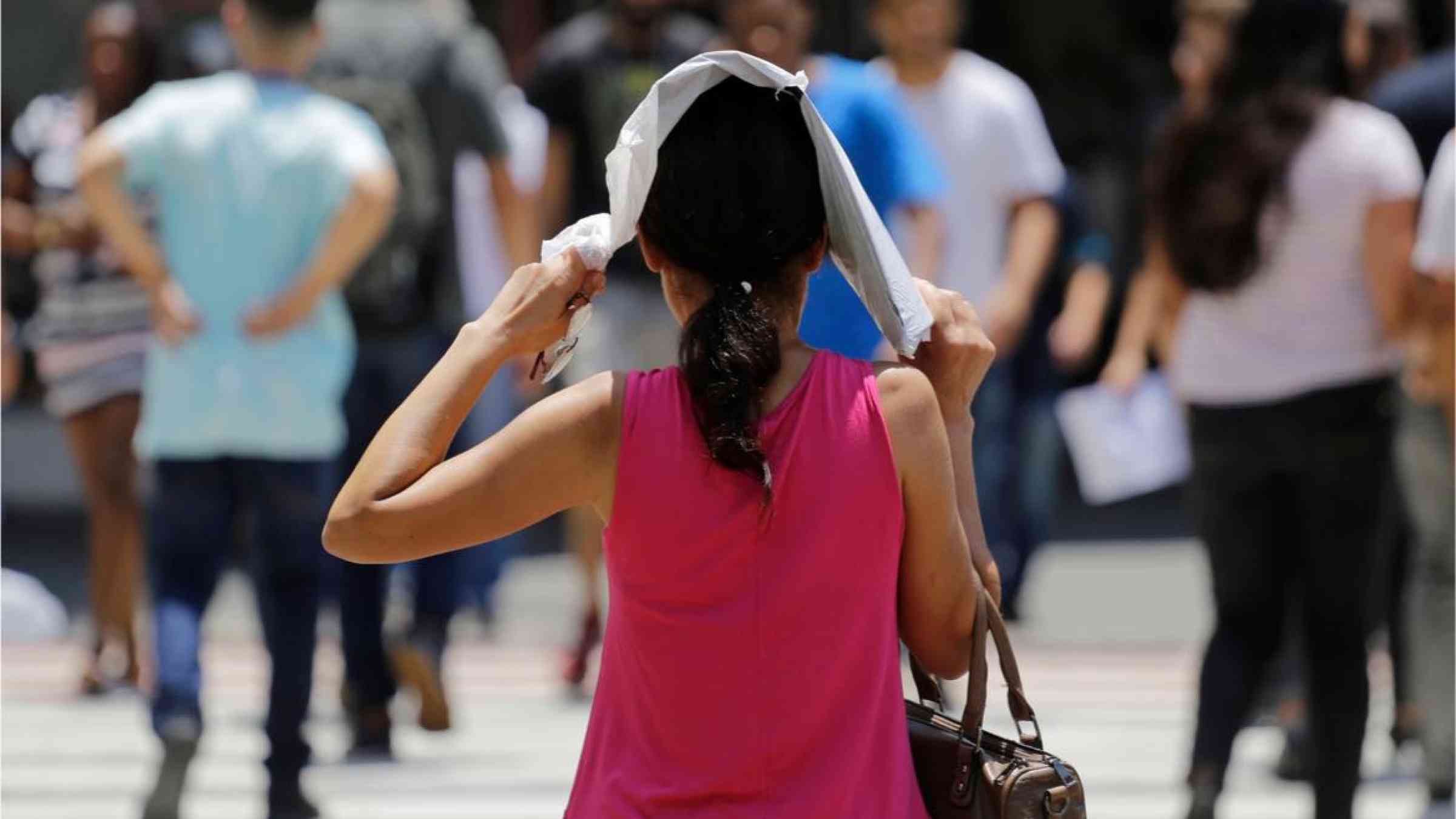 Women covering her head from the sun