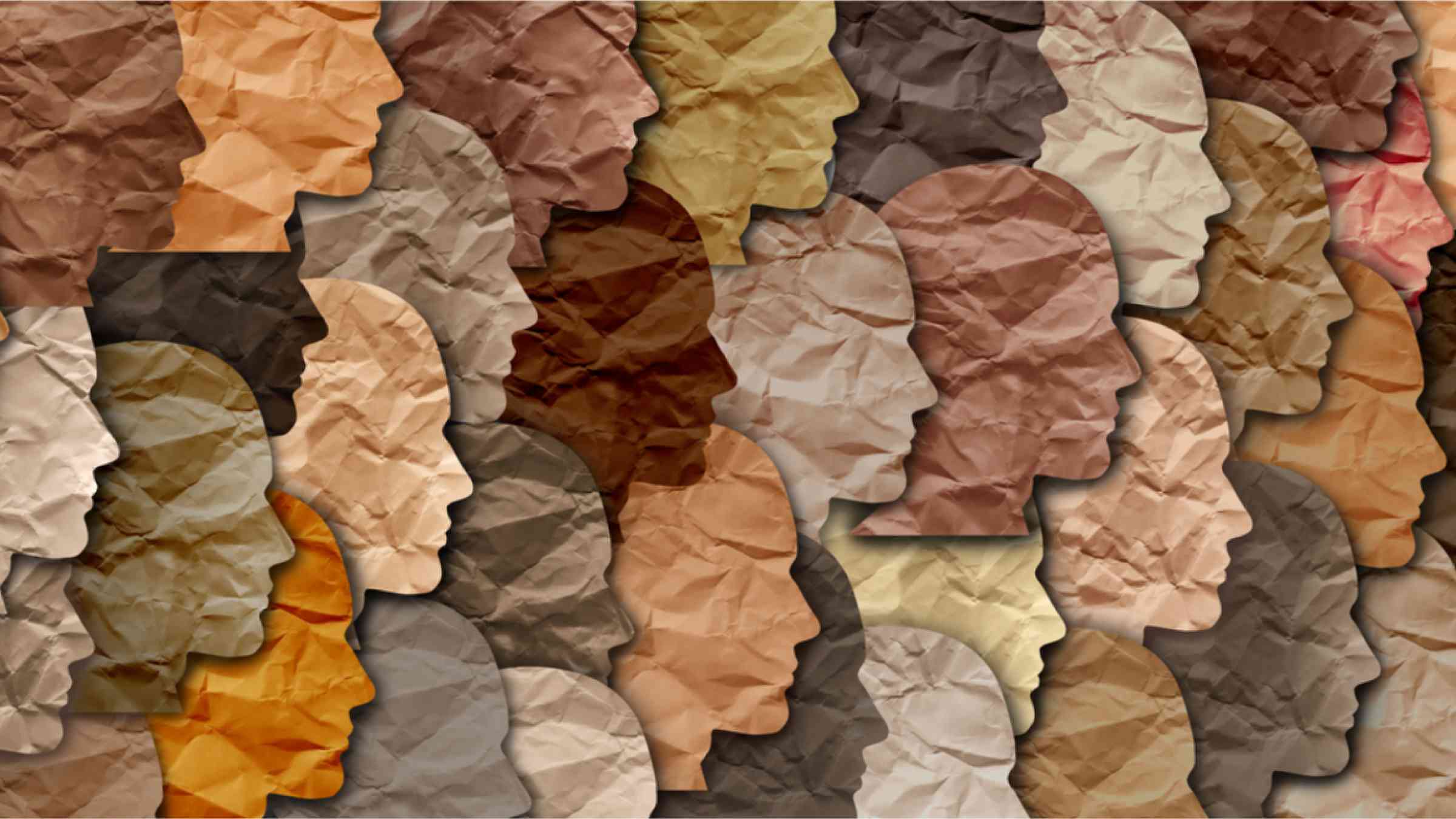 Mosaik with faces cut out of different shades of brown paper.