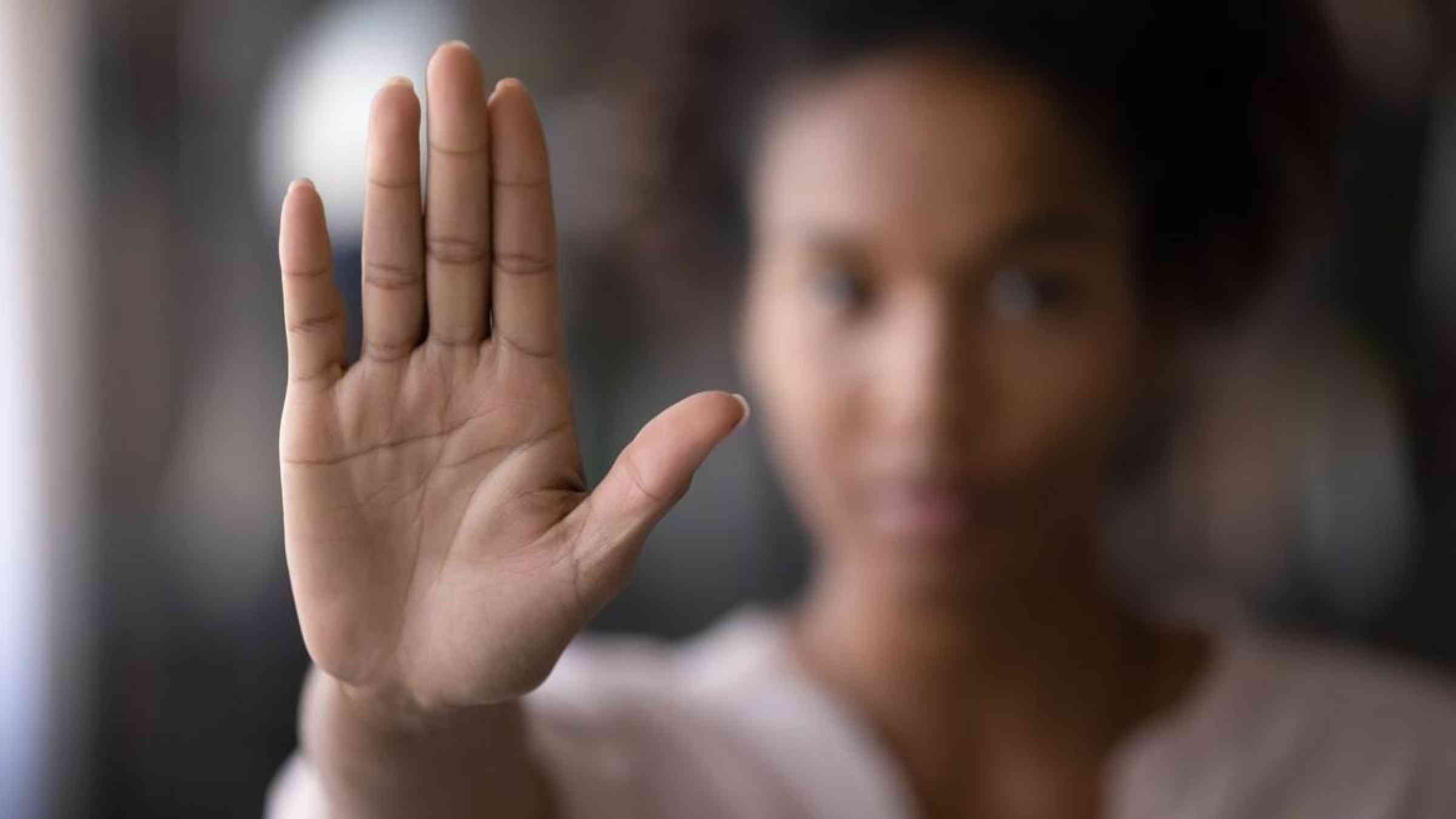 Woman raising her hand against domestic violence