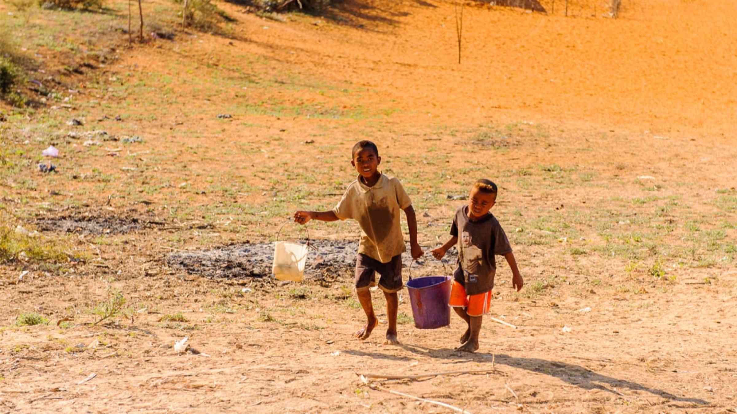 Madagascar boys bringing water in Antananarivo (2011)