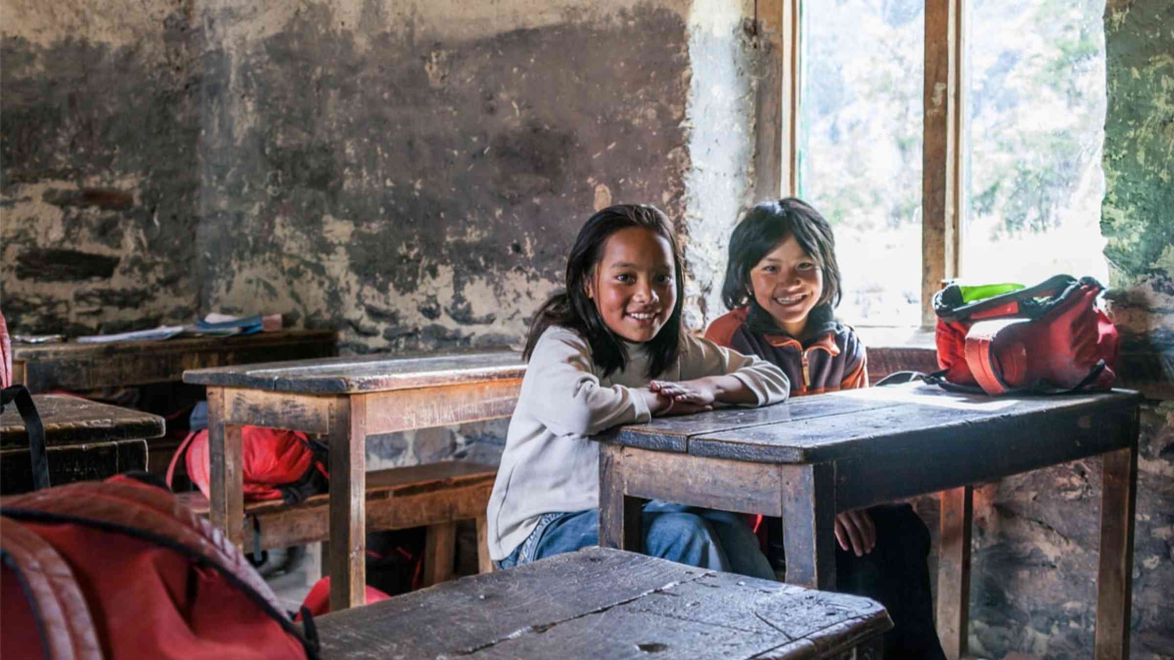 Portrait of two children in a school class in Nepal
