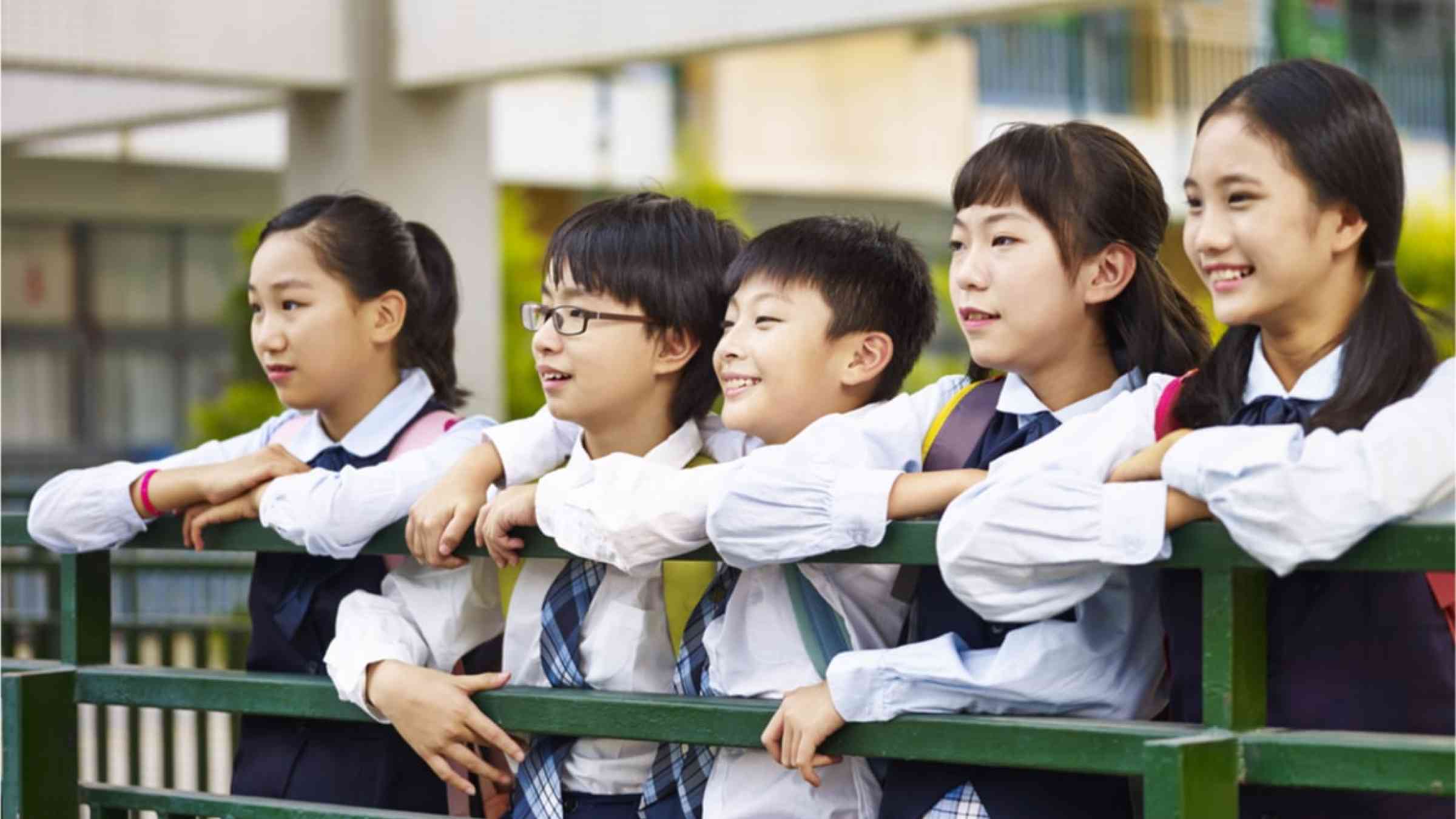 Five Japanese school students in uniform.
