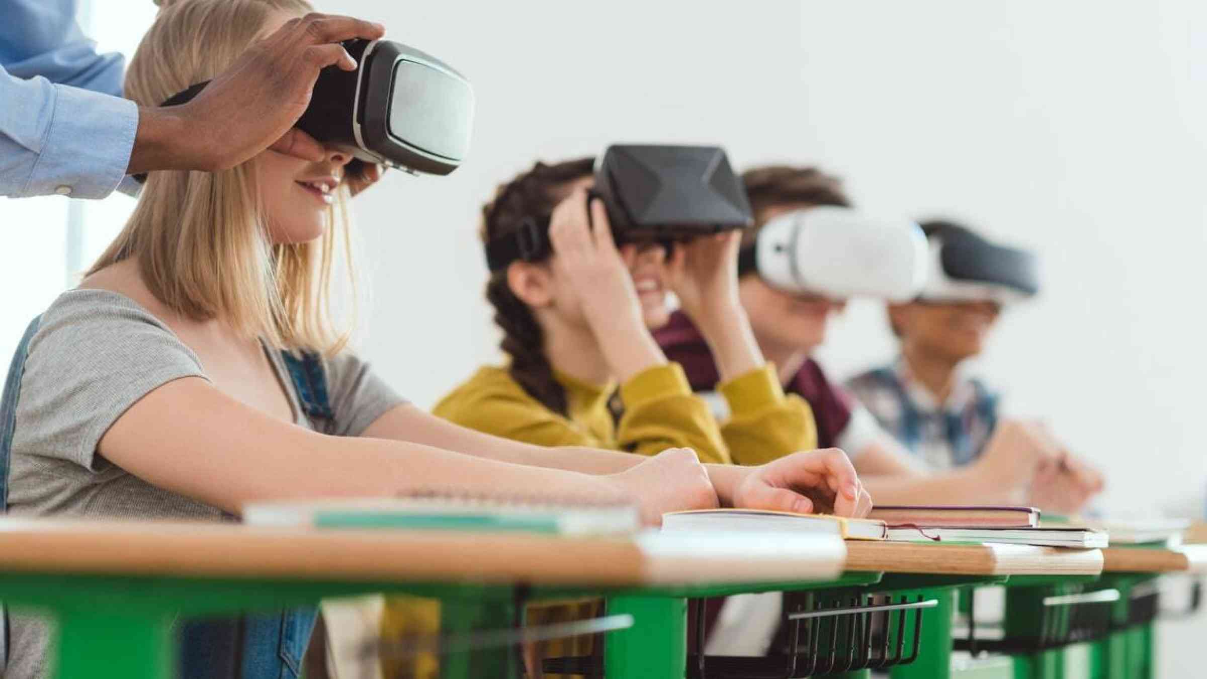 Children wearing virtual reality devices