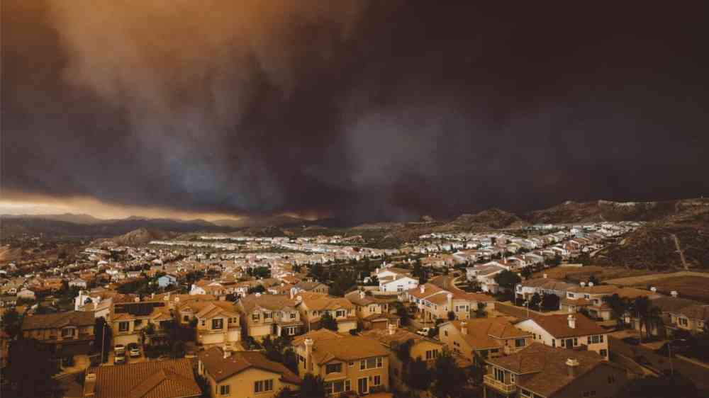 Wildfire and dark clouds approaching Hollywood City
