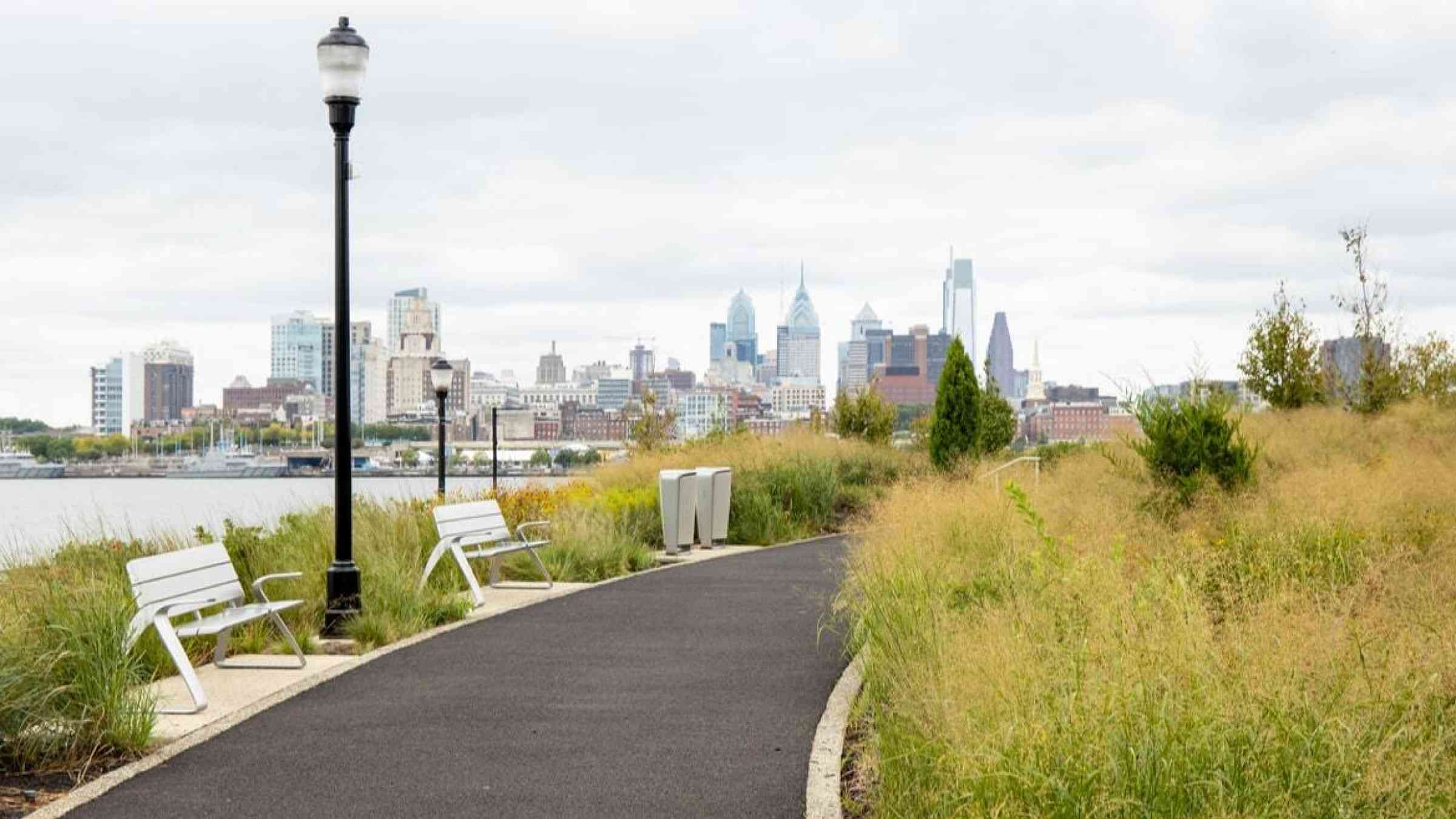 Path through the RCA Pier Park, NJ, in front of the Philadelphia skyline