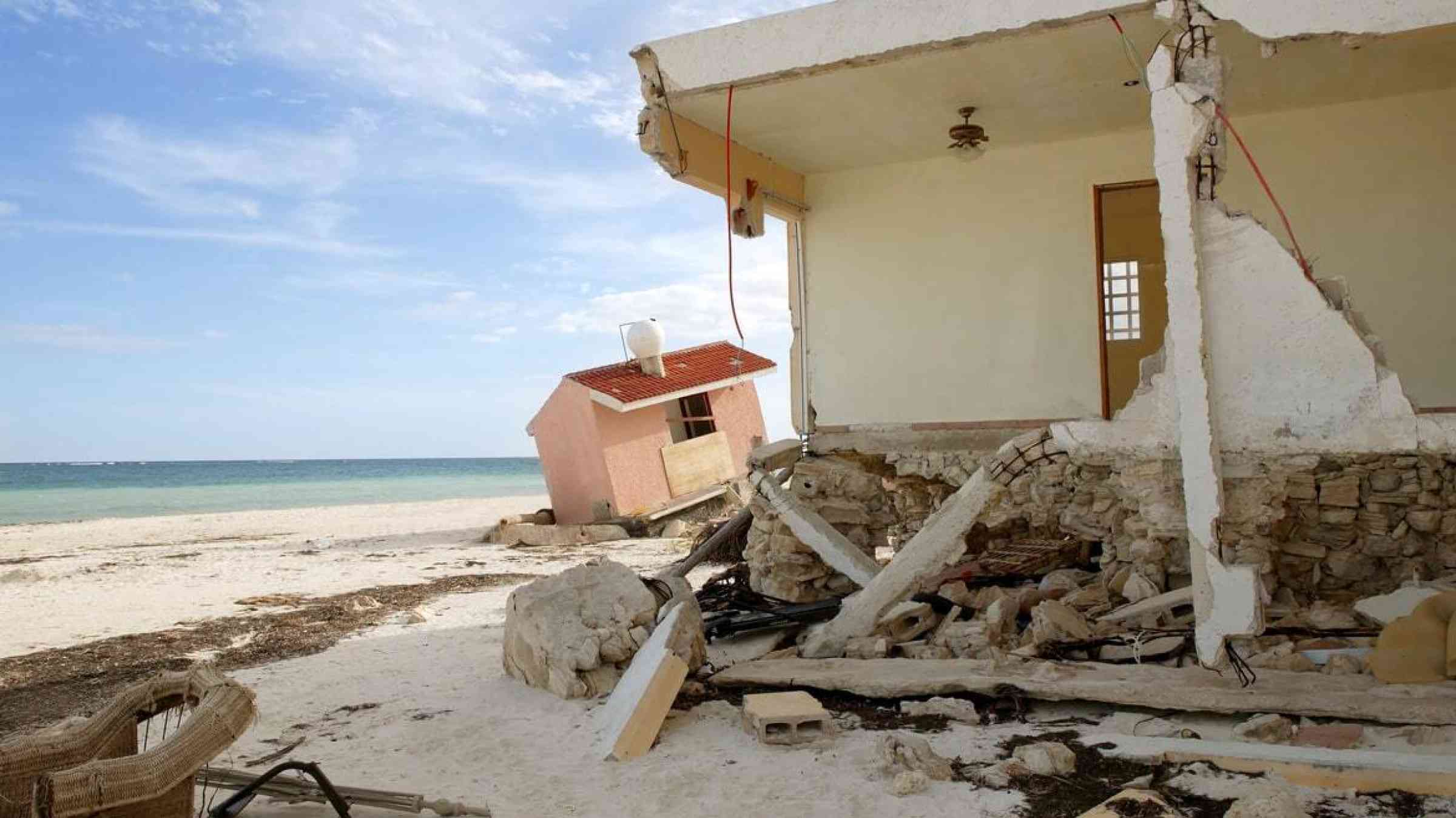 Destroyed houses on a beachfront after a hurricane