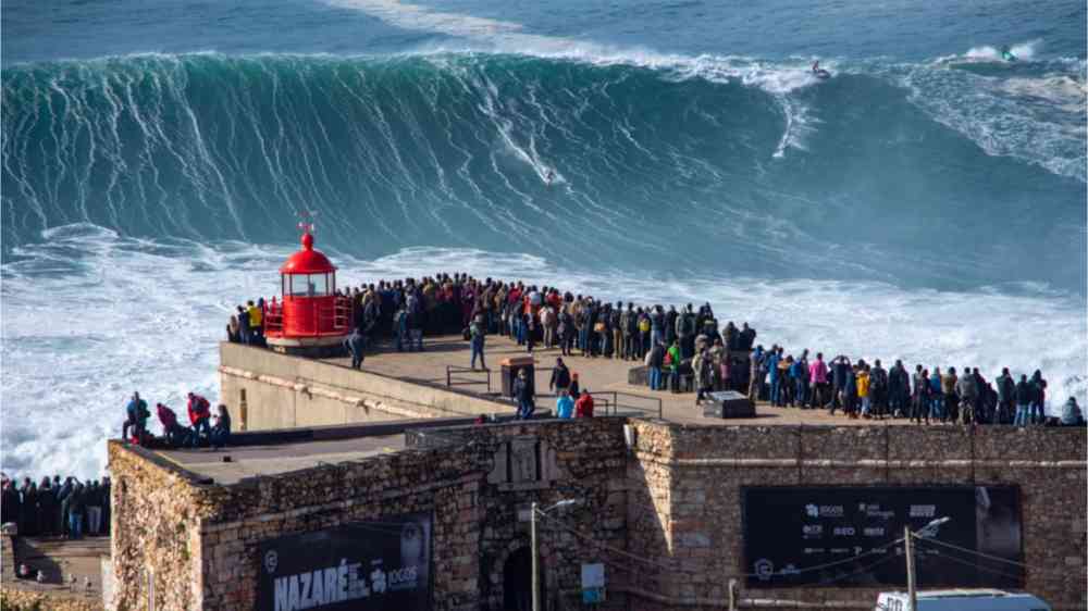 20 meters waves in front of lighthouse in Nazari, Portugal.