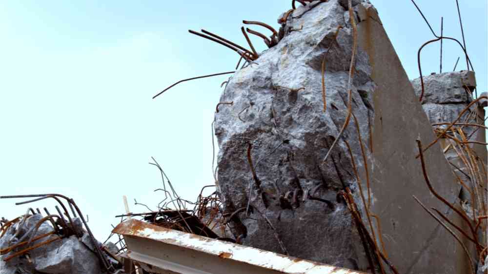 Debris and twisted metal of collapsed bridge