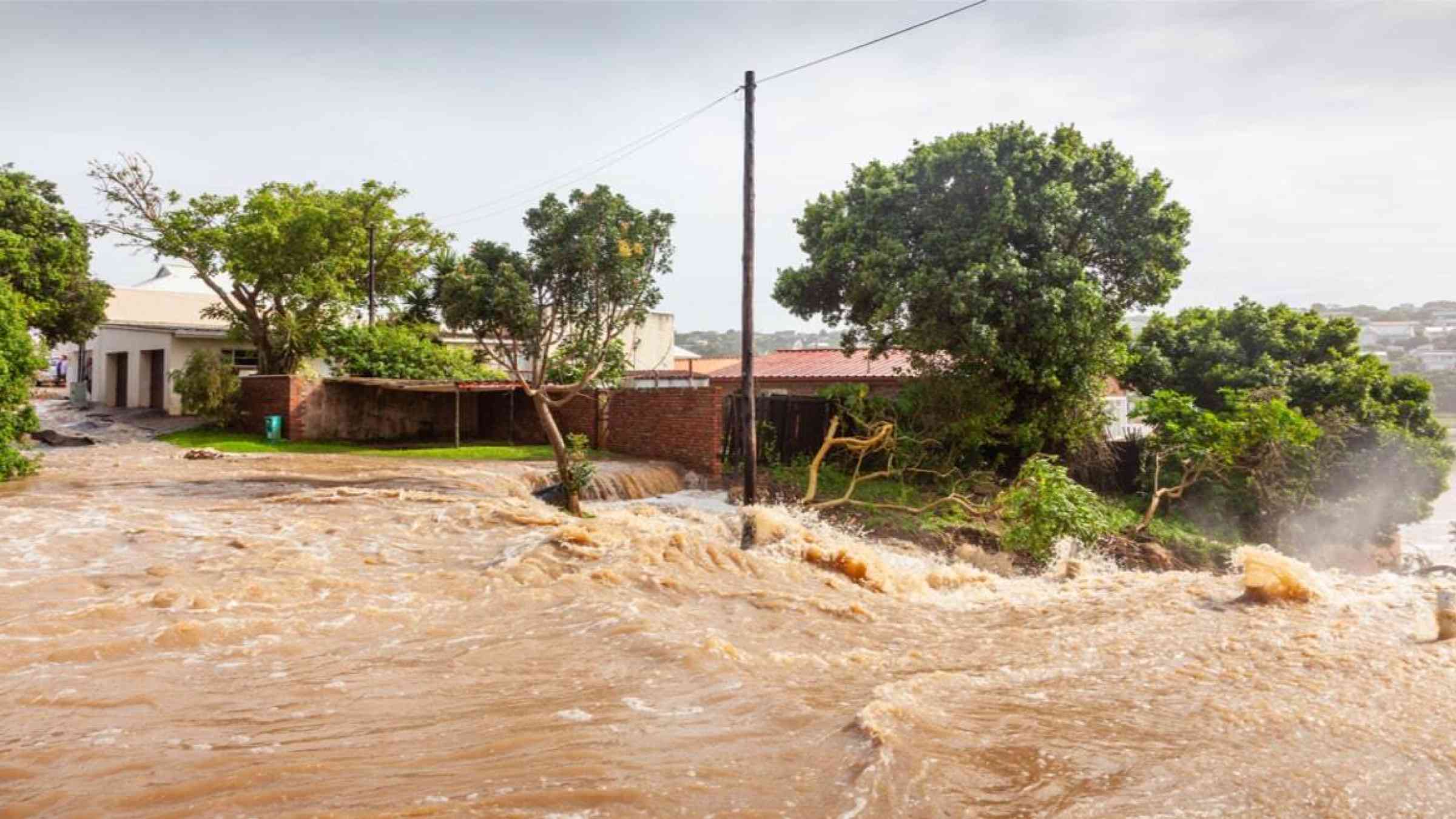 Flooded street and house in Eastern South Africa