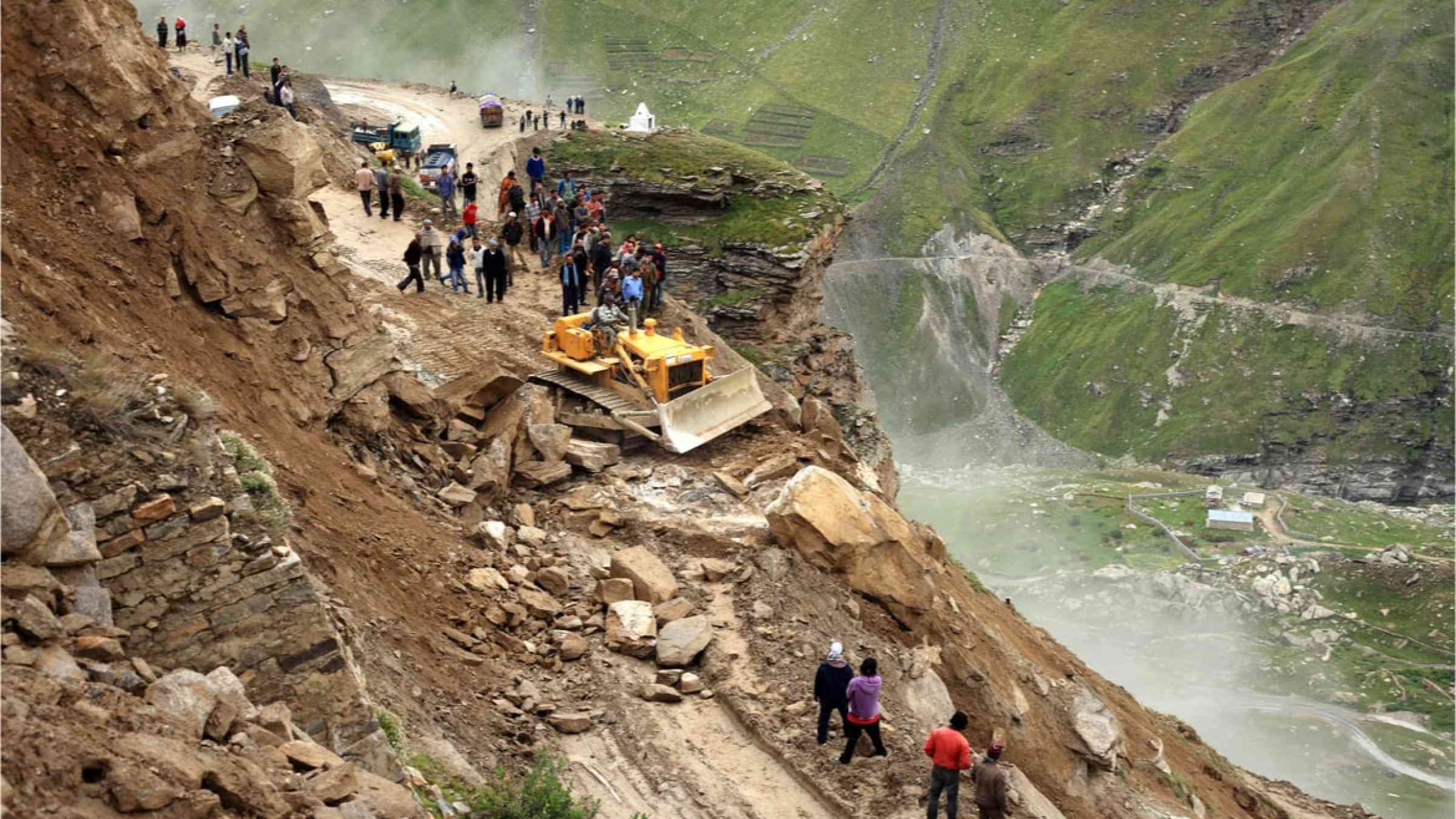 Border Roads Organization clear the road to Leh affected by landslide on August 29, 2012 in Manali, India. Landslides are regular phenomenon of this high altitude region.