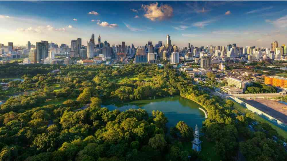 Lumpini park and Bangkok city building view from roof top bar on hotel, in Bangkok, Thailand