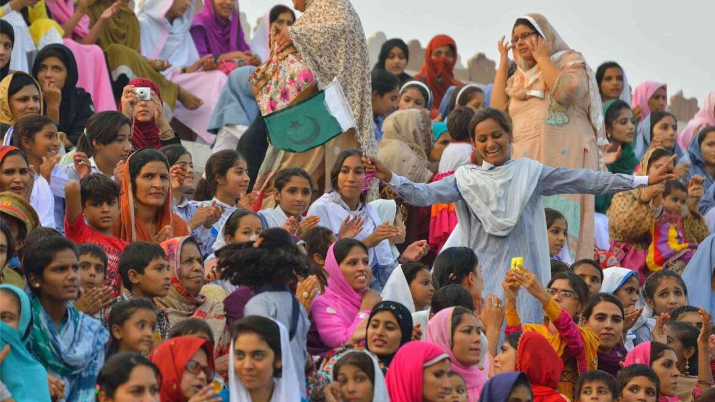 A crowd of women gather for a border ceremony in Lahore, Pakistan