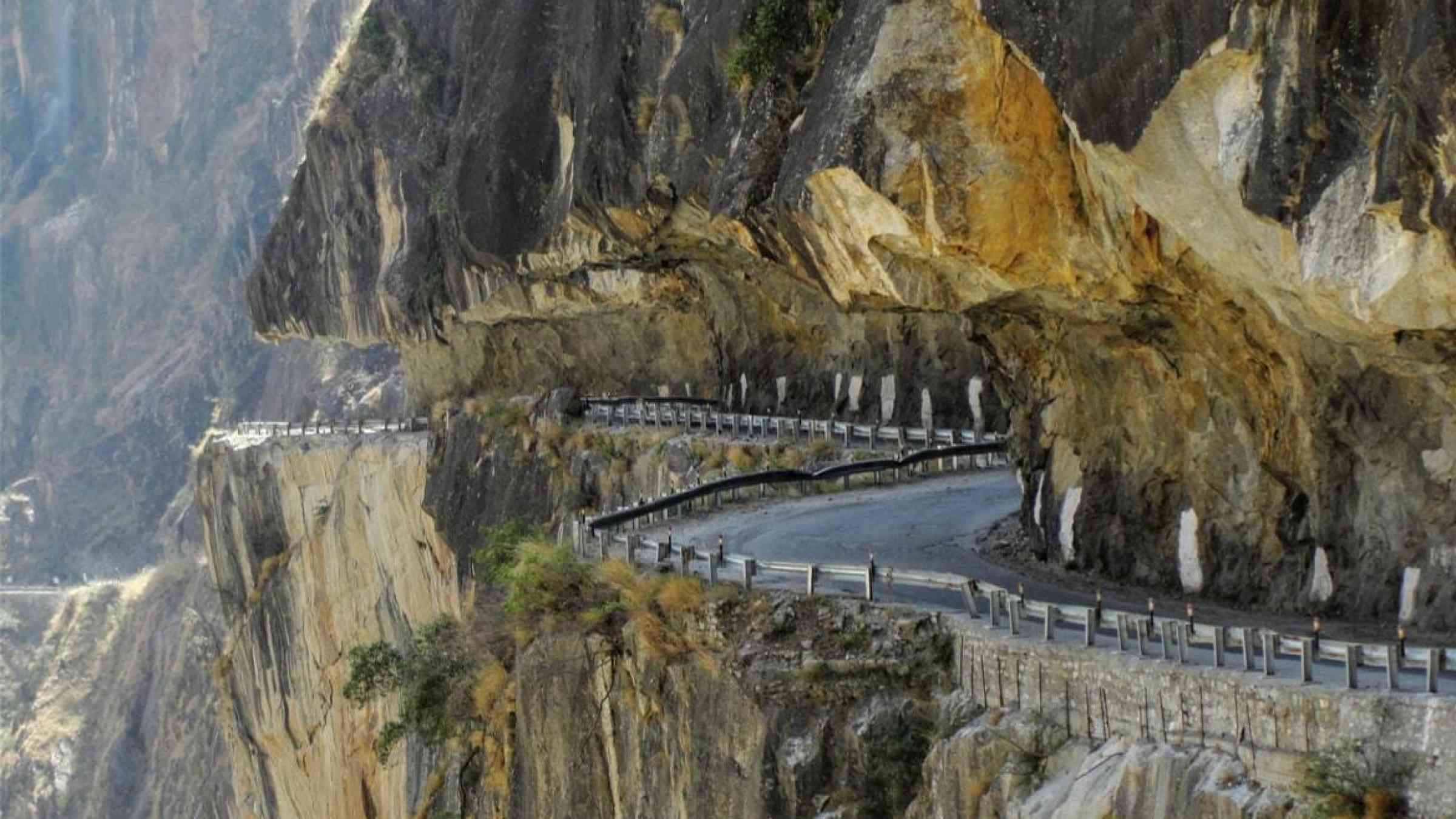 Taranda Dhank Road, carved into a mountain slope in Himachal Pradesh, India