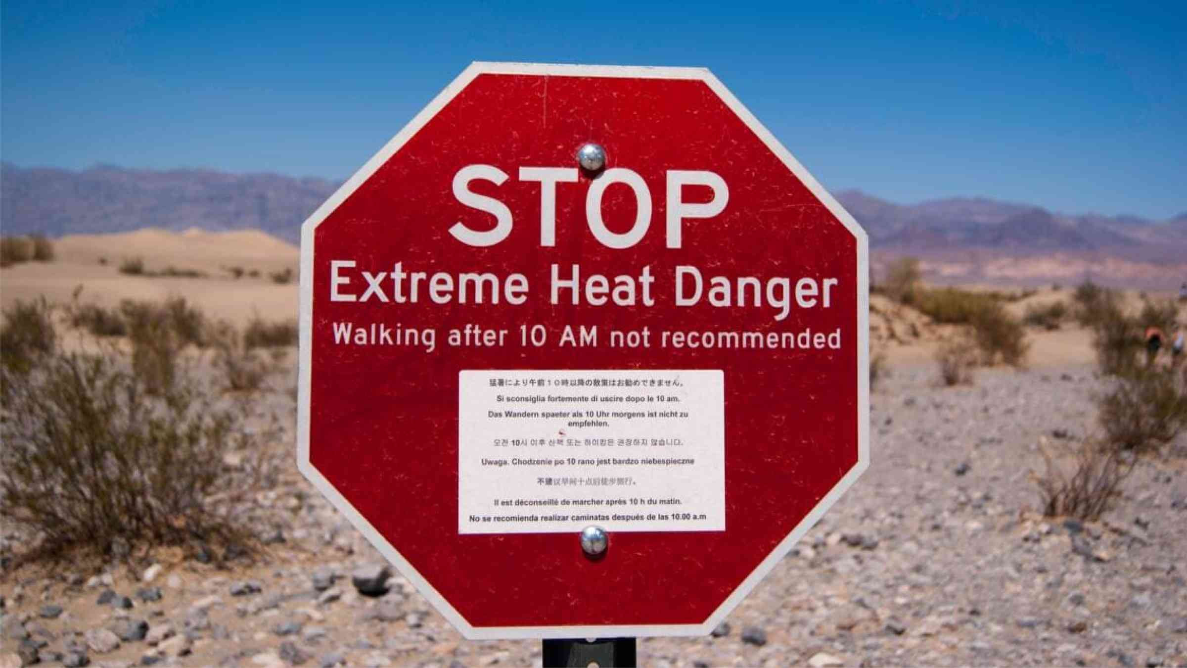 An extreme heat warning sign warns tourists in Death Valley, California