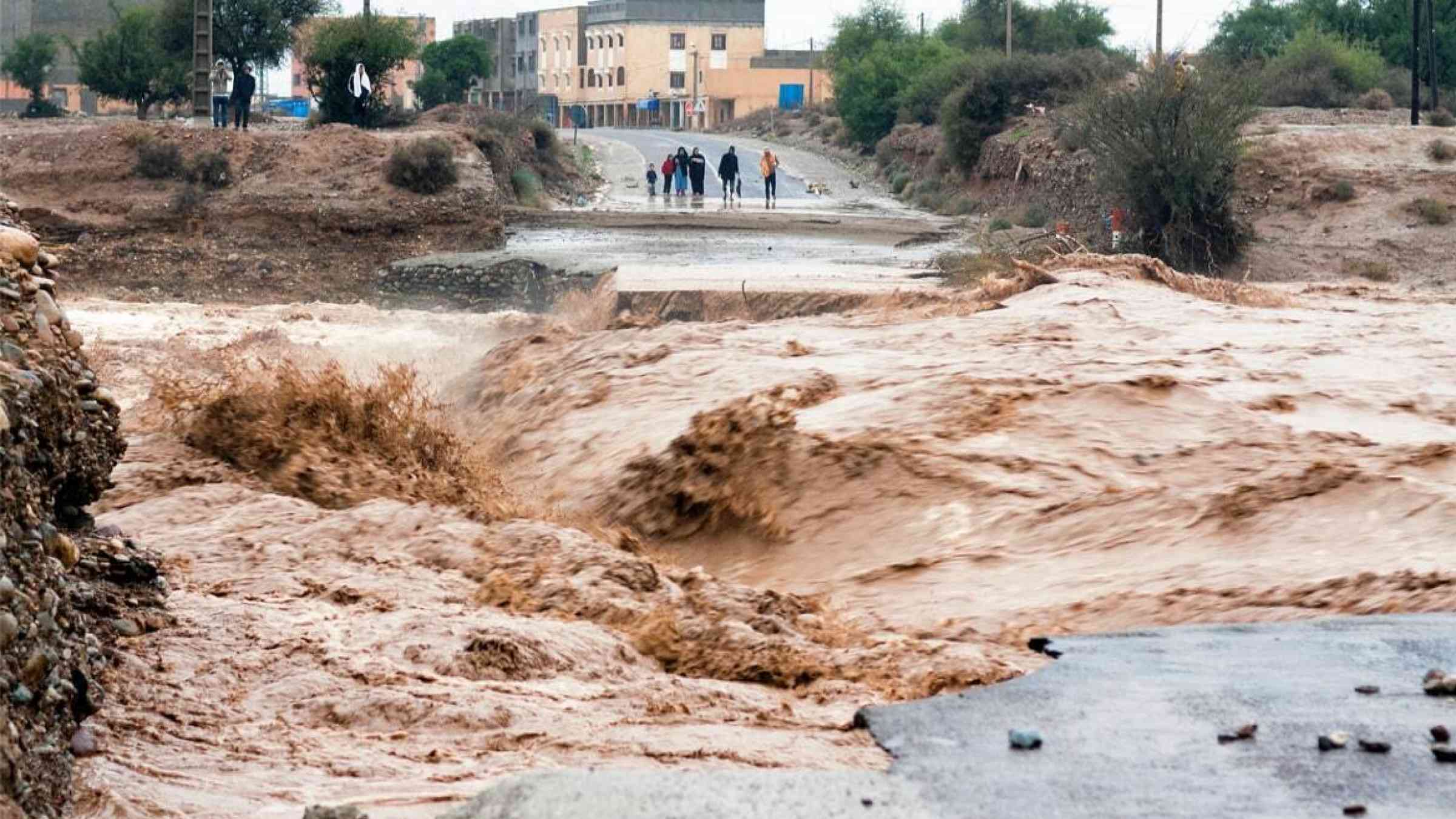 A road is destroyed by flash flooding in Sidi Ouaaziz, Morocco