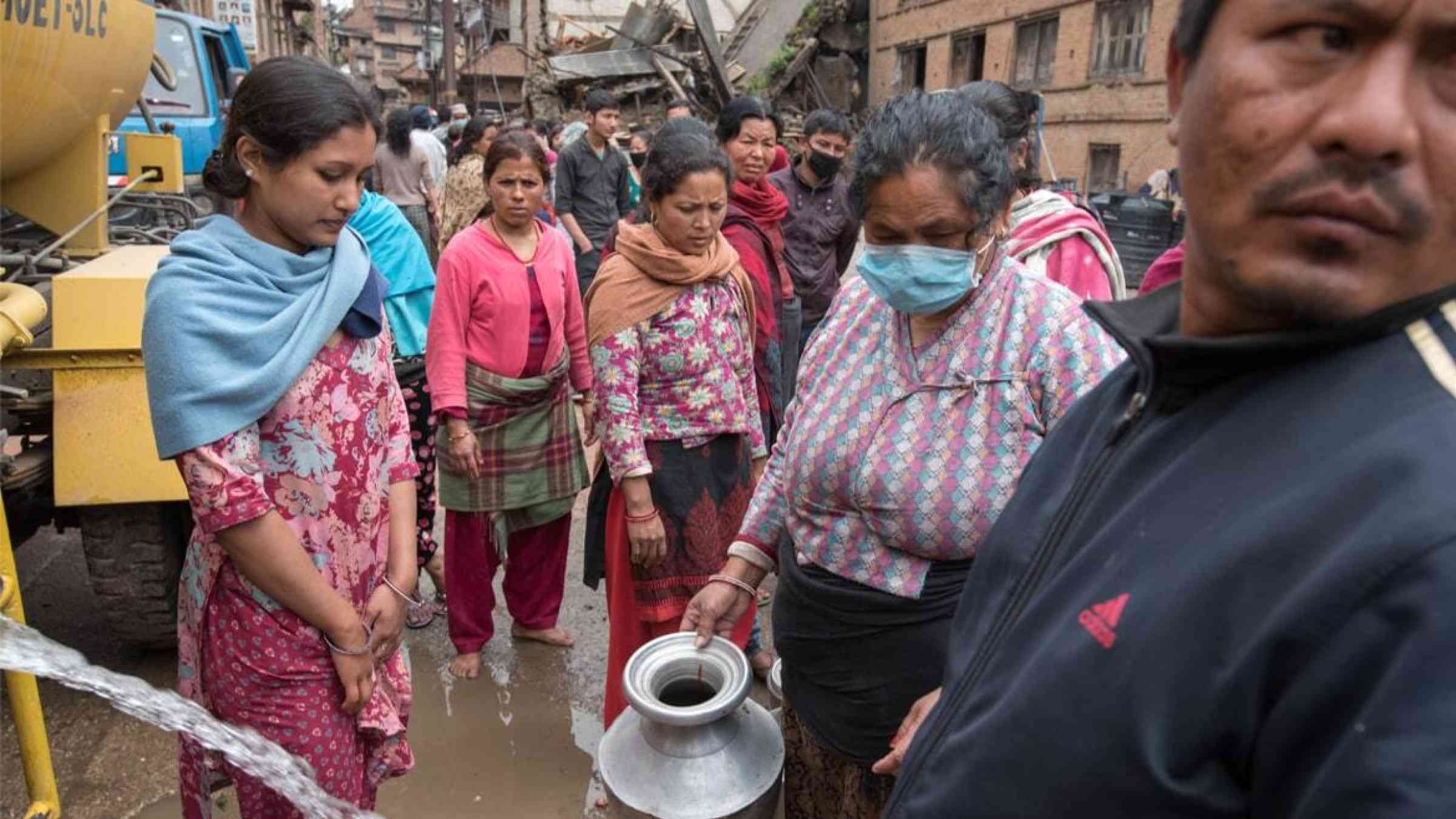 People line up for water rations in Kathmandu, Nepal