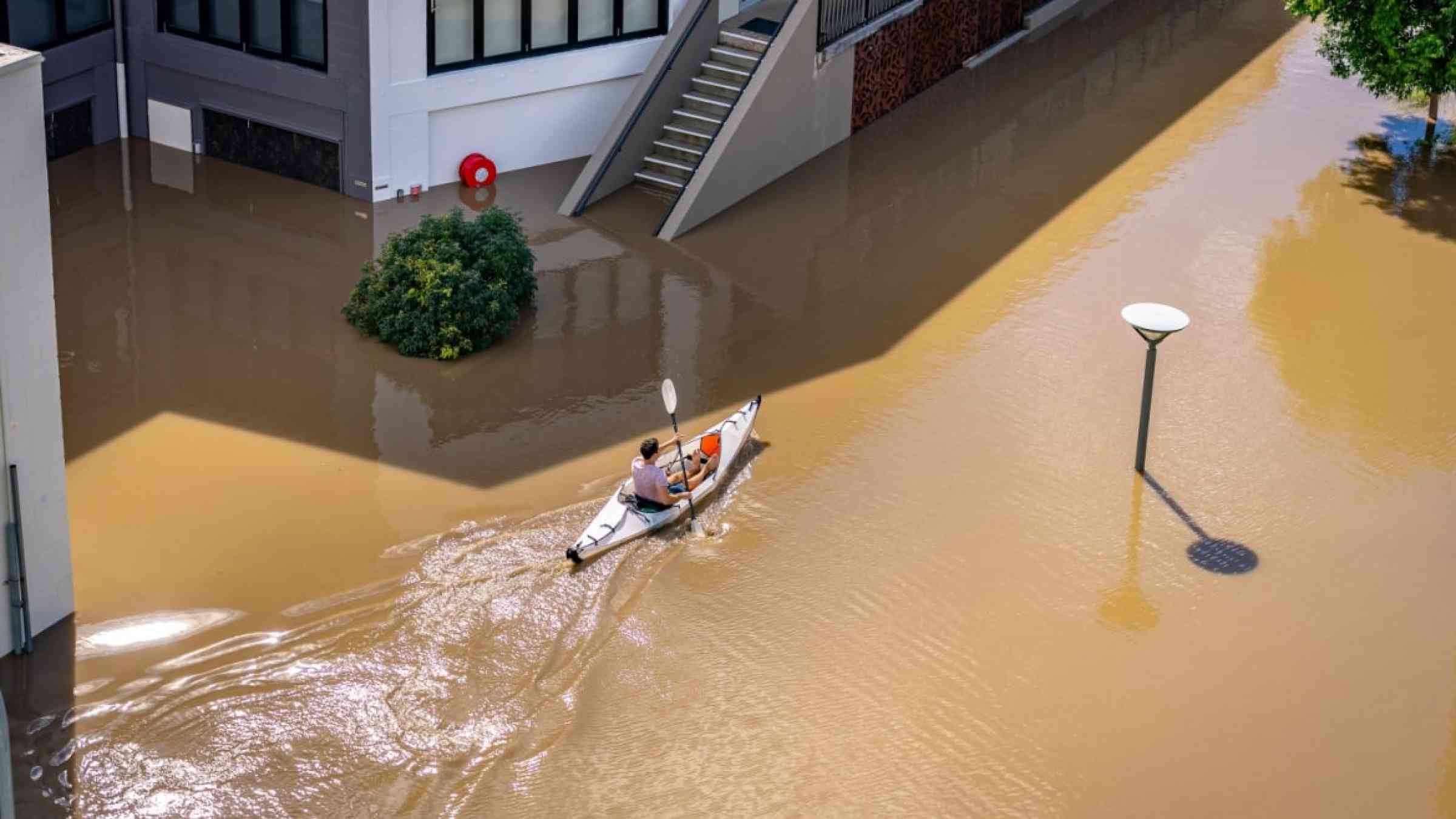 A person doing kayak in the flooded streets of Brisbane, Australia (2022)